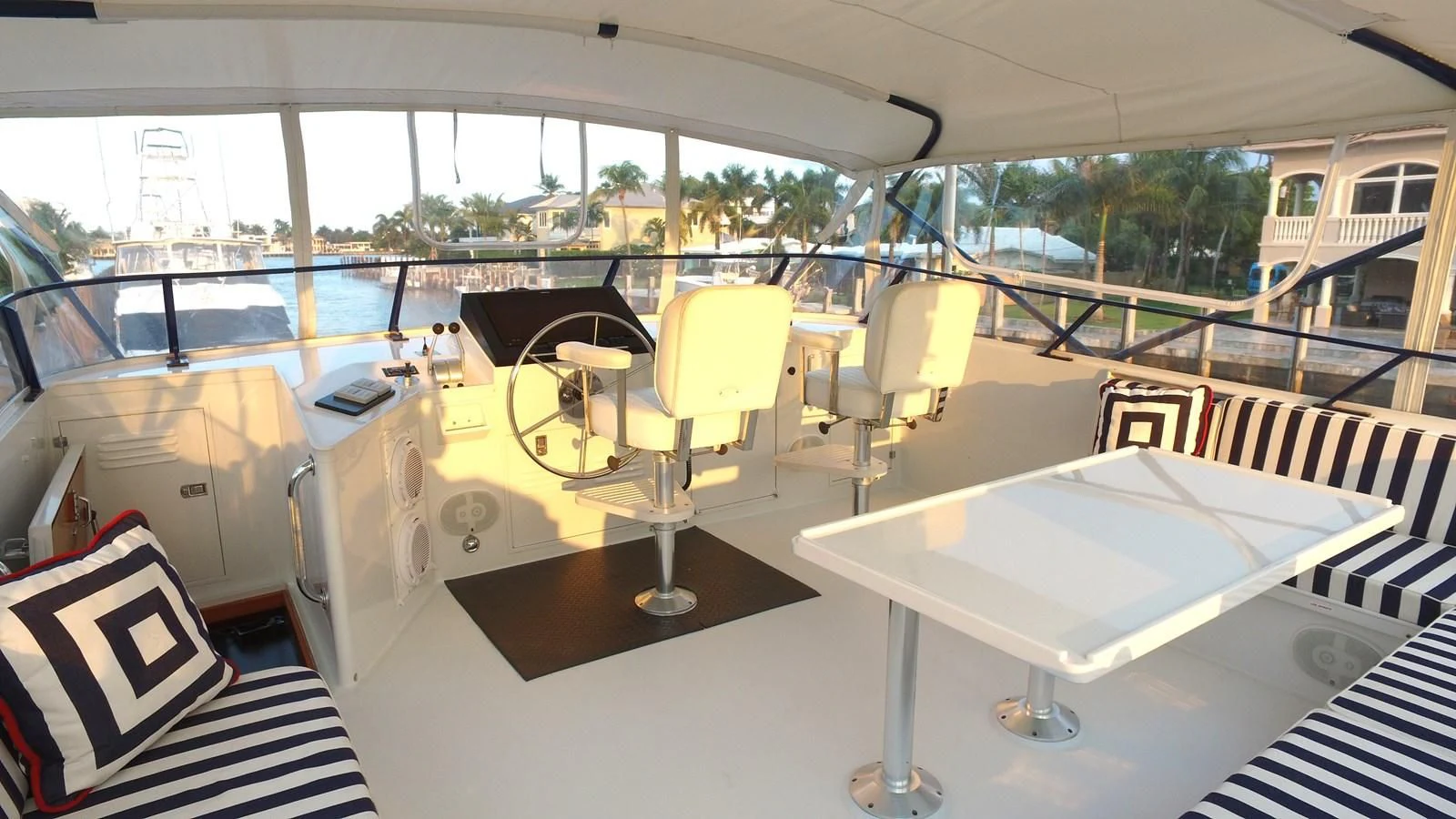 a boat with chairs and tables aboard BAREFOOT V Yacht for Sale