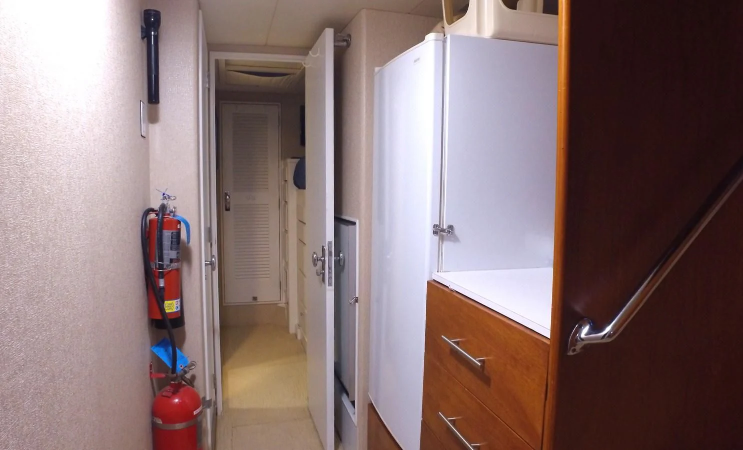 a room with white cabinets aboard BAREFOOT V Yacht for Sale