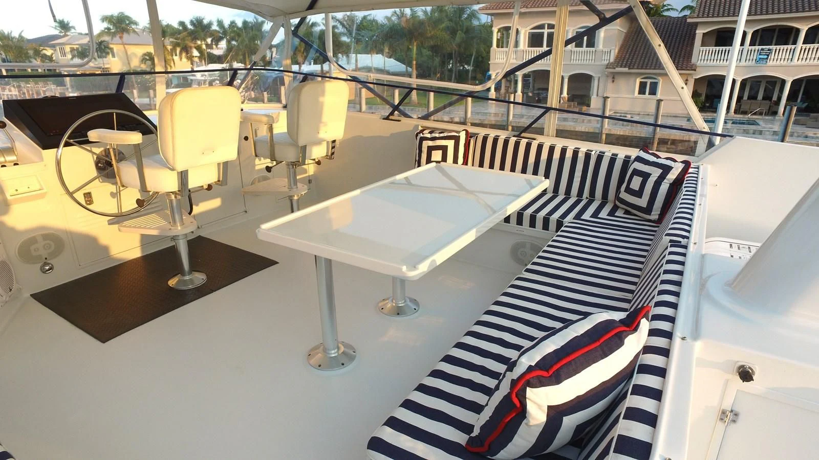 a table and chairs outside a building aboard BAREFOOT V Yacht for Sale