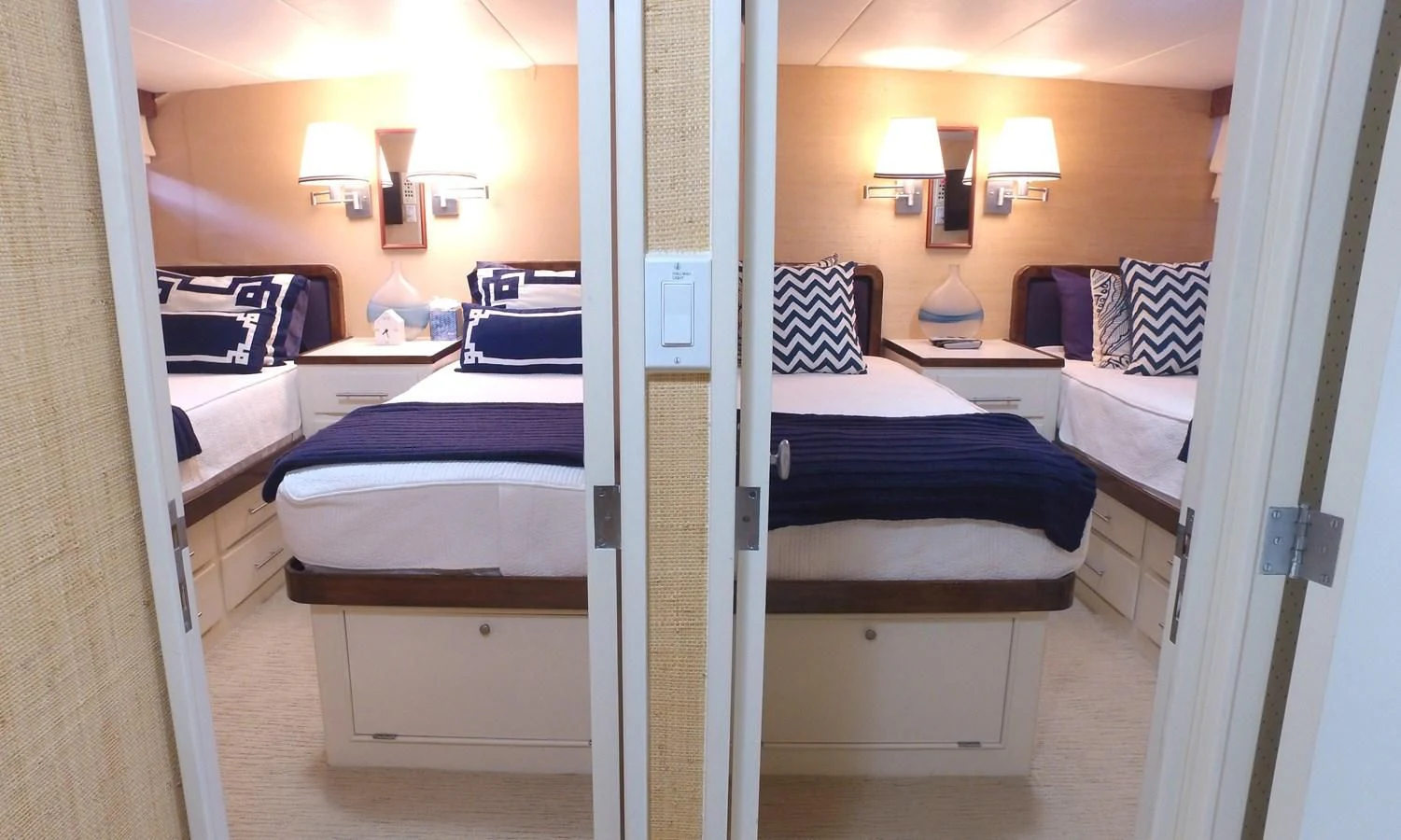a room with a couple of beds aboard BAREFOOT V Yacht for Sale