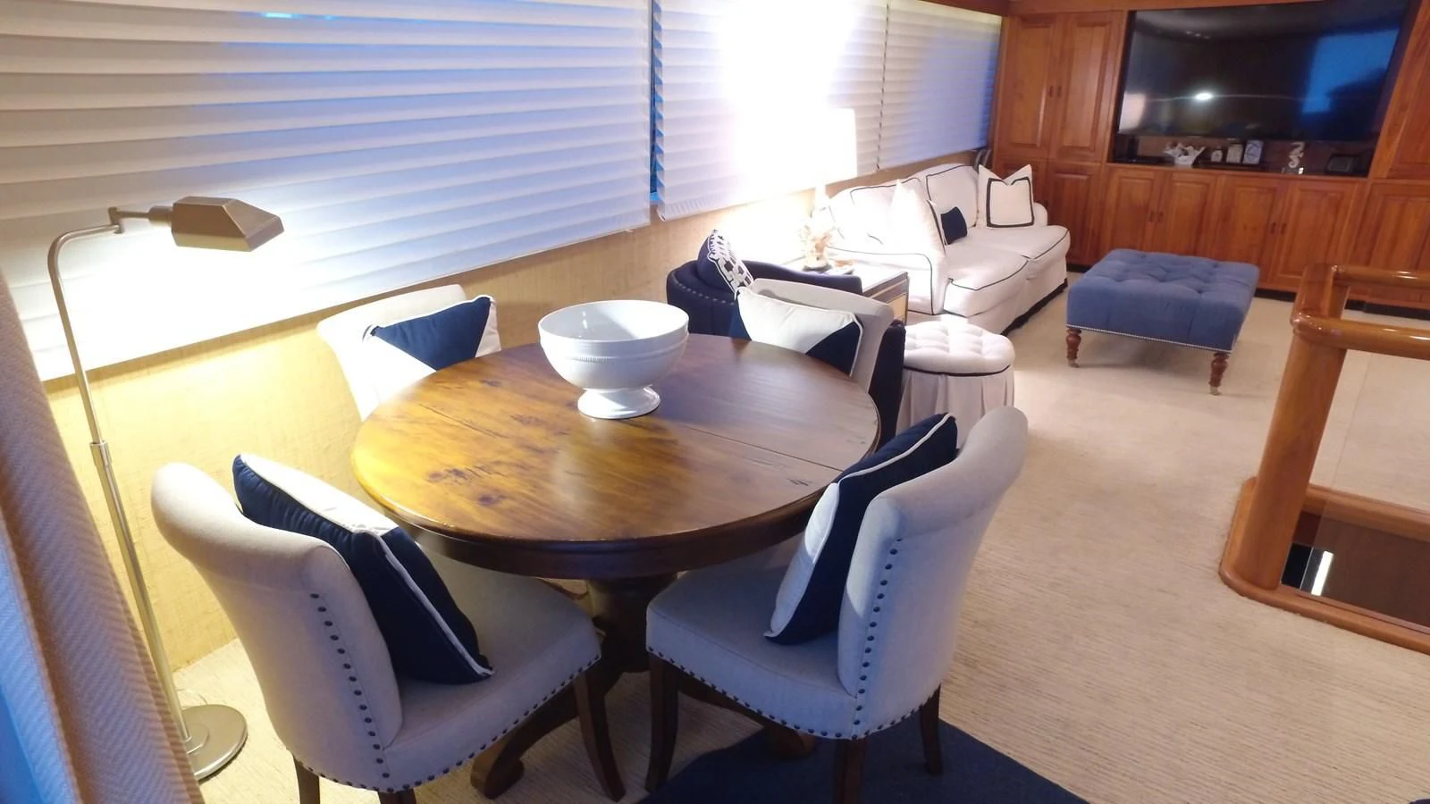 a dining table and chairs in a living room aboard BAREFOOT V Yacht for Sale
