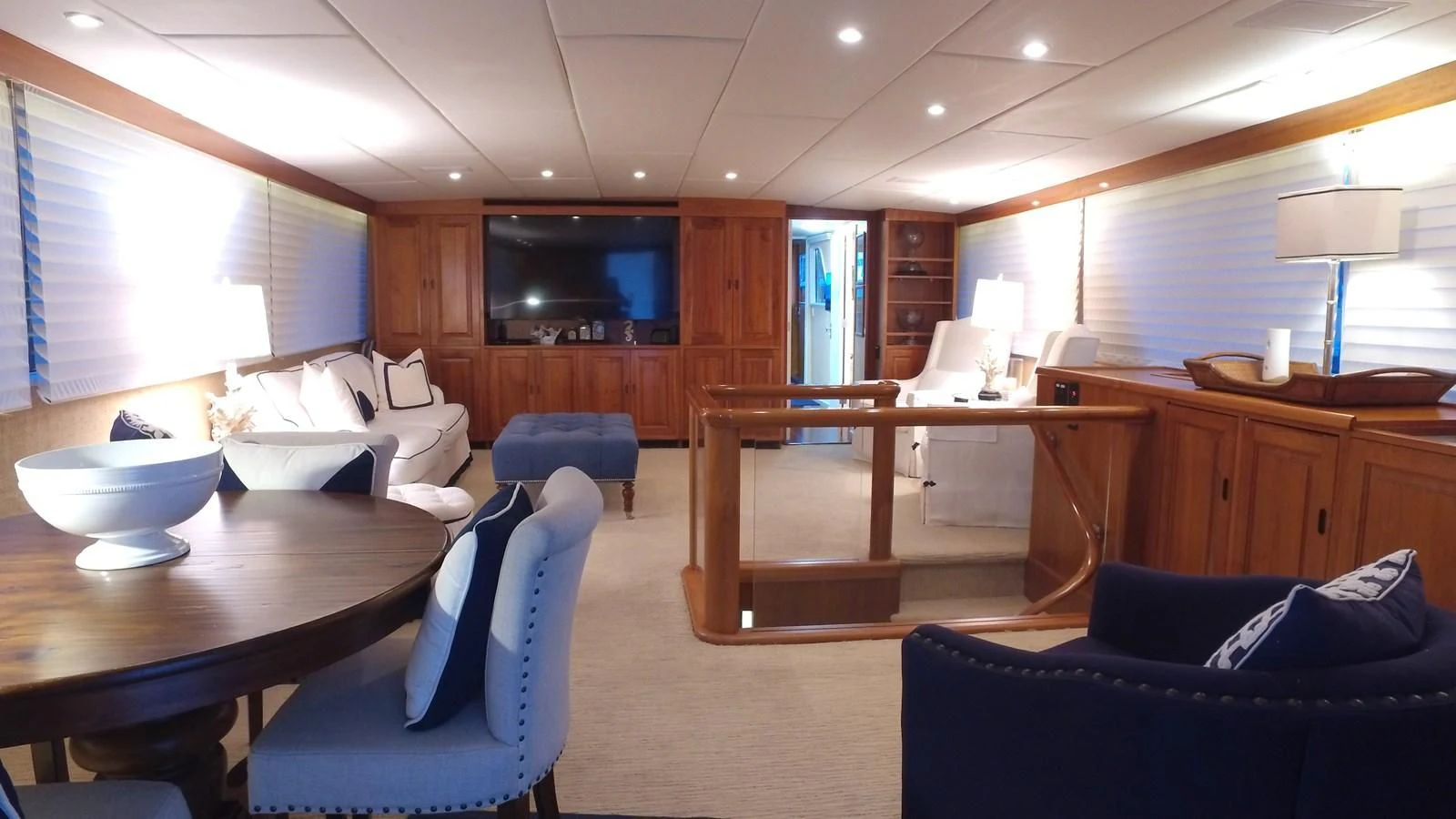 a living room with a table and chairs aboard BAREFOOT V Yacht for Sale