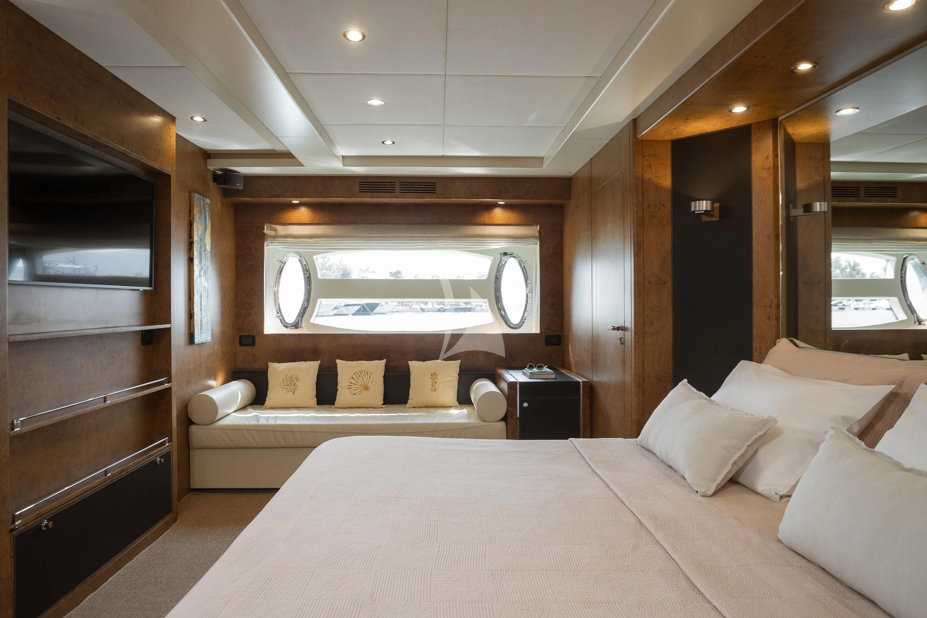 a room with a bed and a television aboard ANLIA Yacht for Sale
