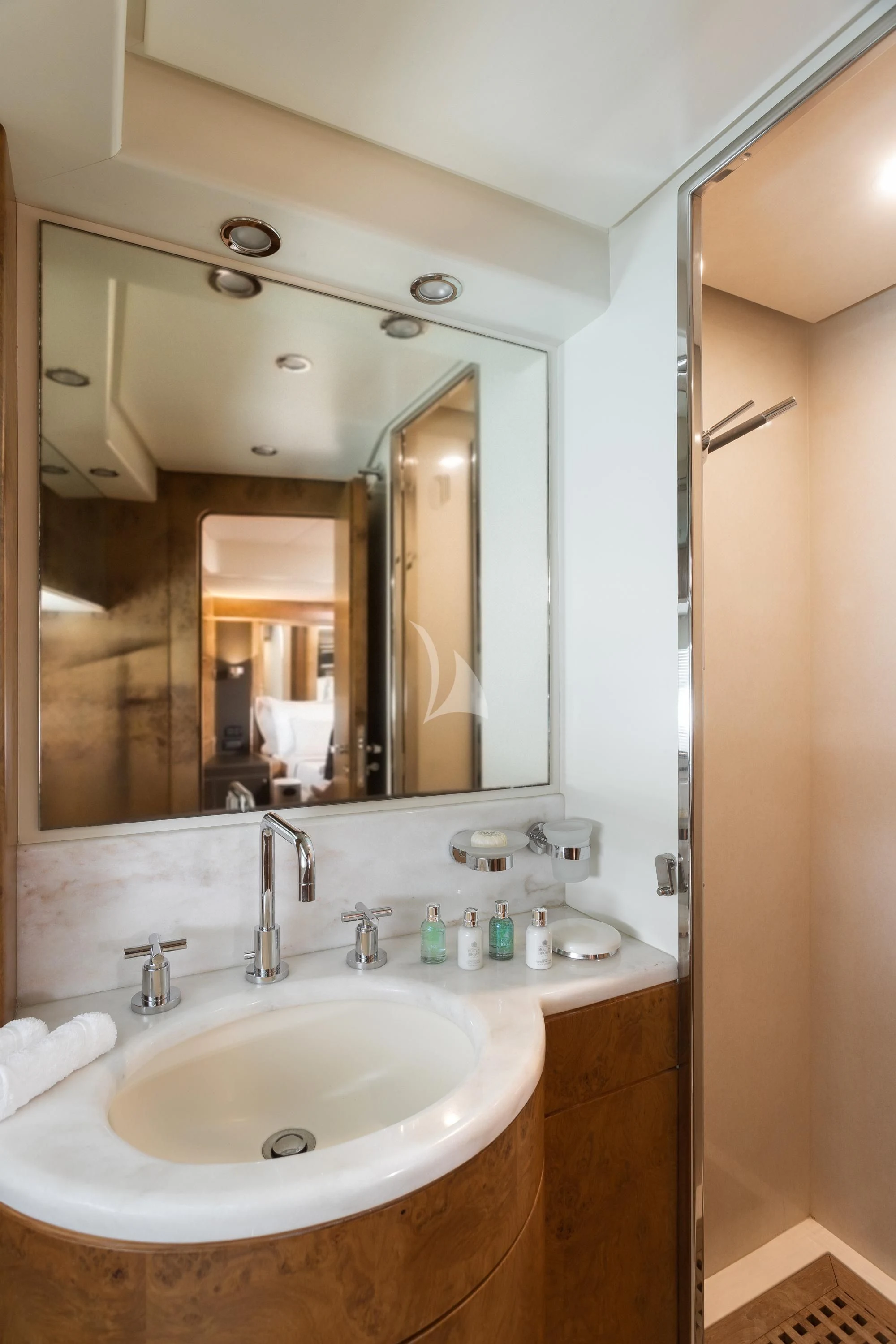a bathroom with a large mirror aboard ANLIA Yacht for Sale