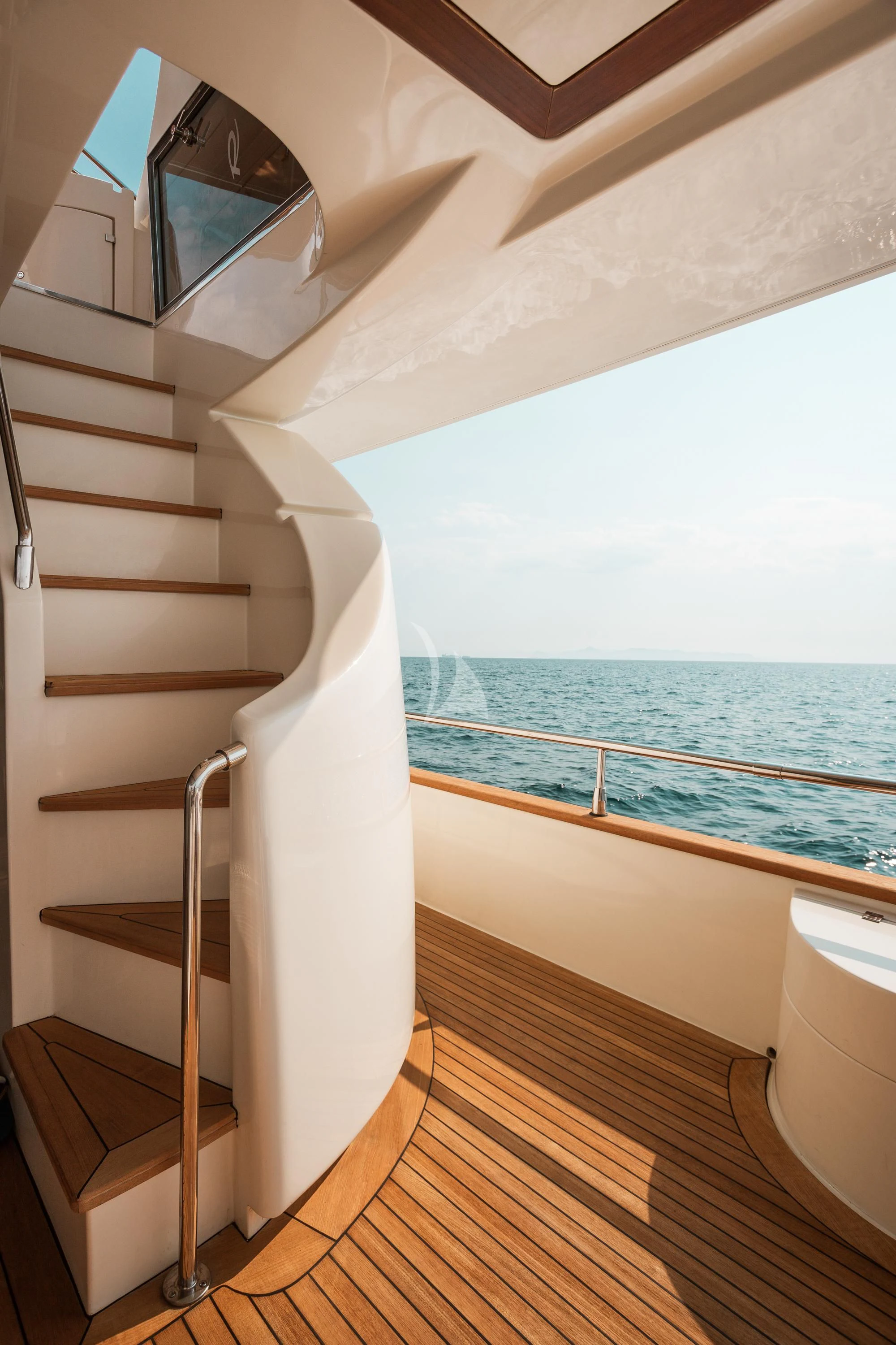 a white bunk bed next to a white railing on a wooden floor aboard ANLIA Yacht for Sale