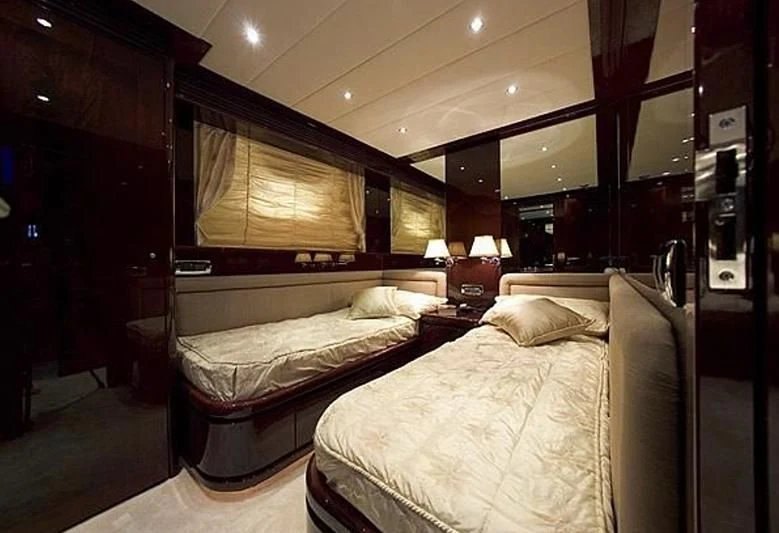 a room with a couple of beds aboard ANLIA Yacht for Sale