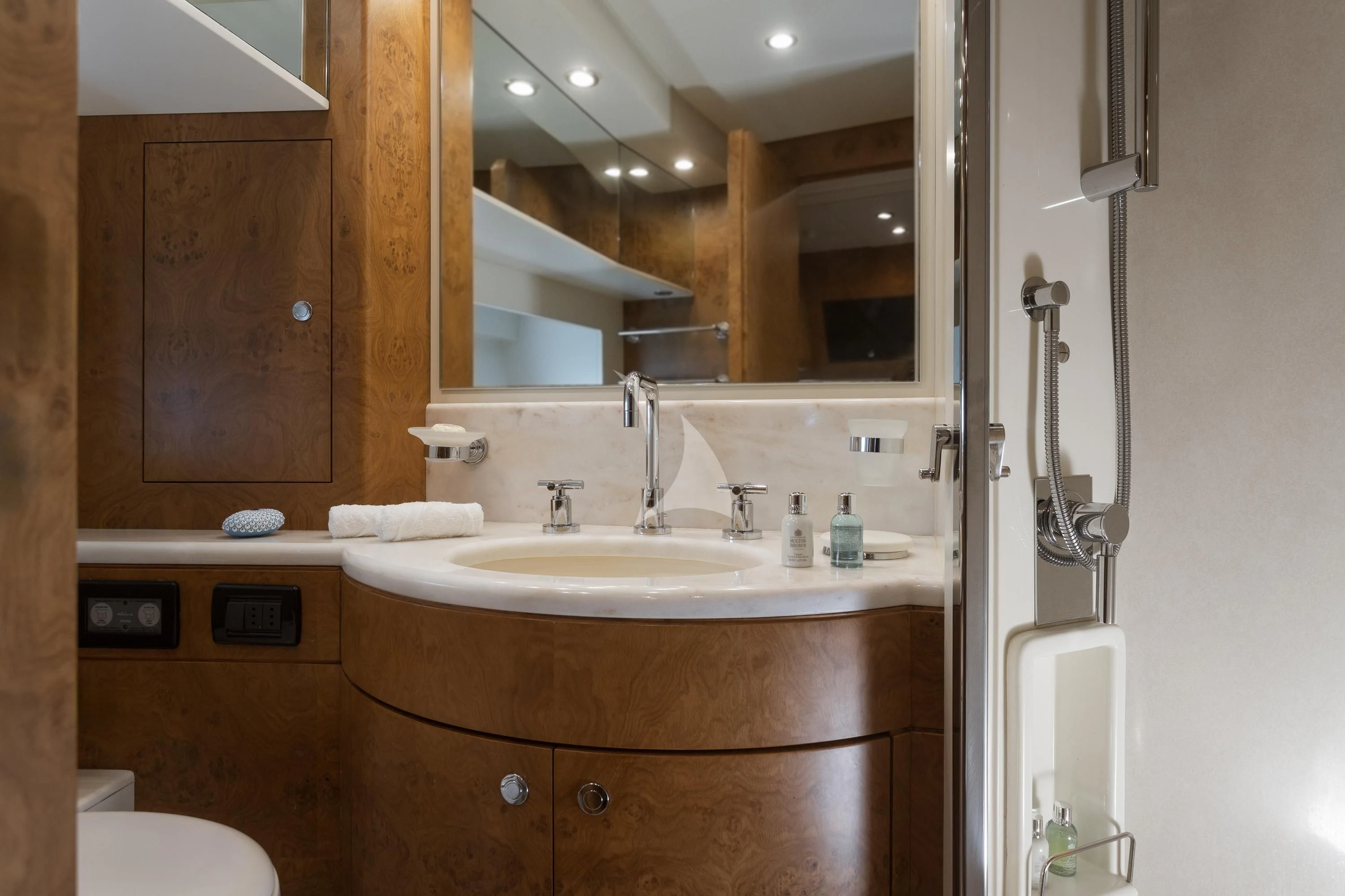 a bathroom with a large mirror aboard ANLIA Yacht for Sale