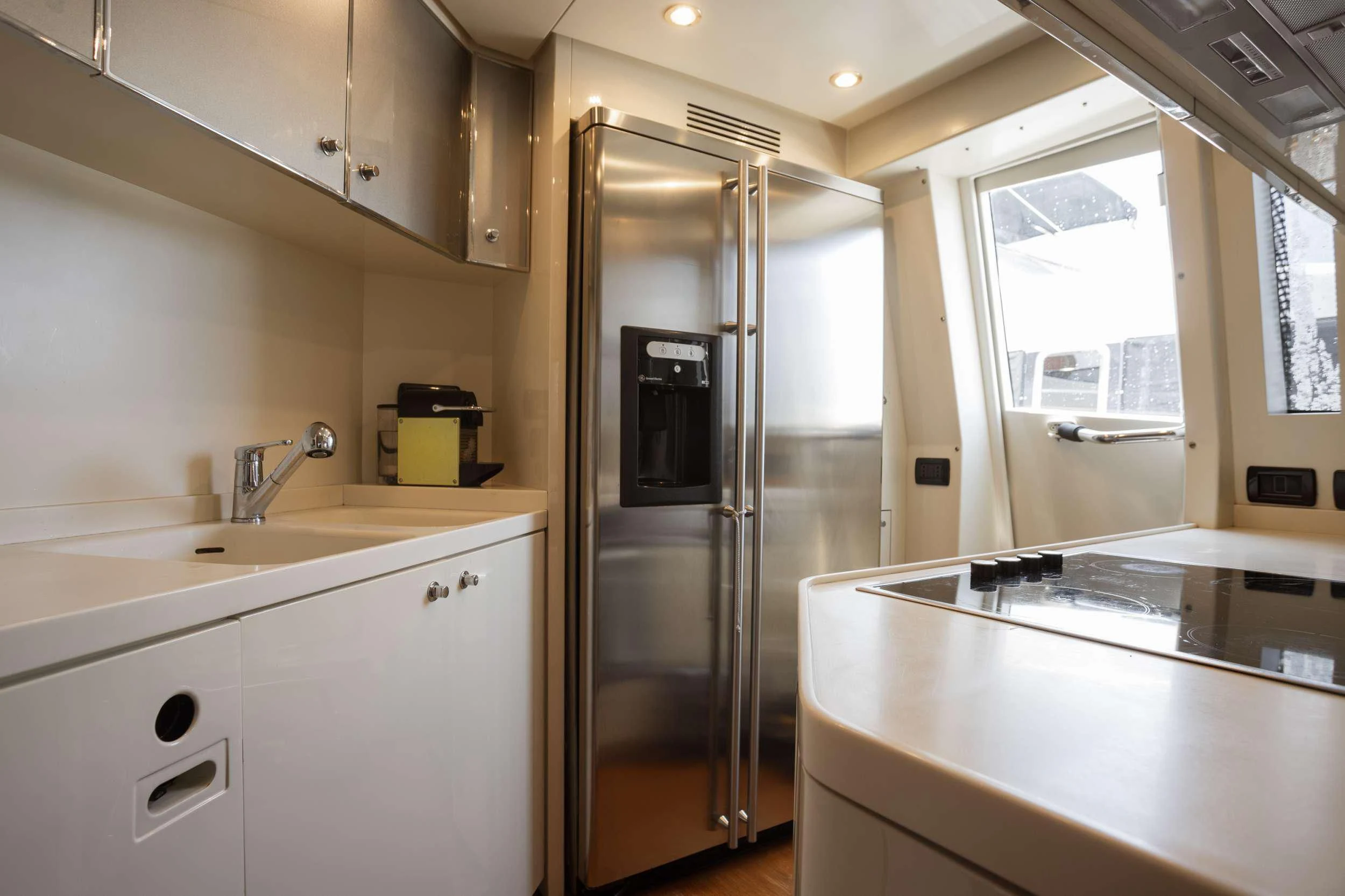 a kitchen with a refrigerator aboard ANLIA Yacht for Sale