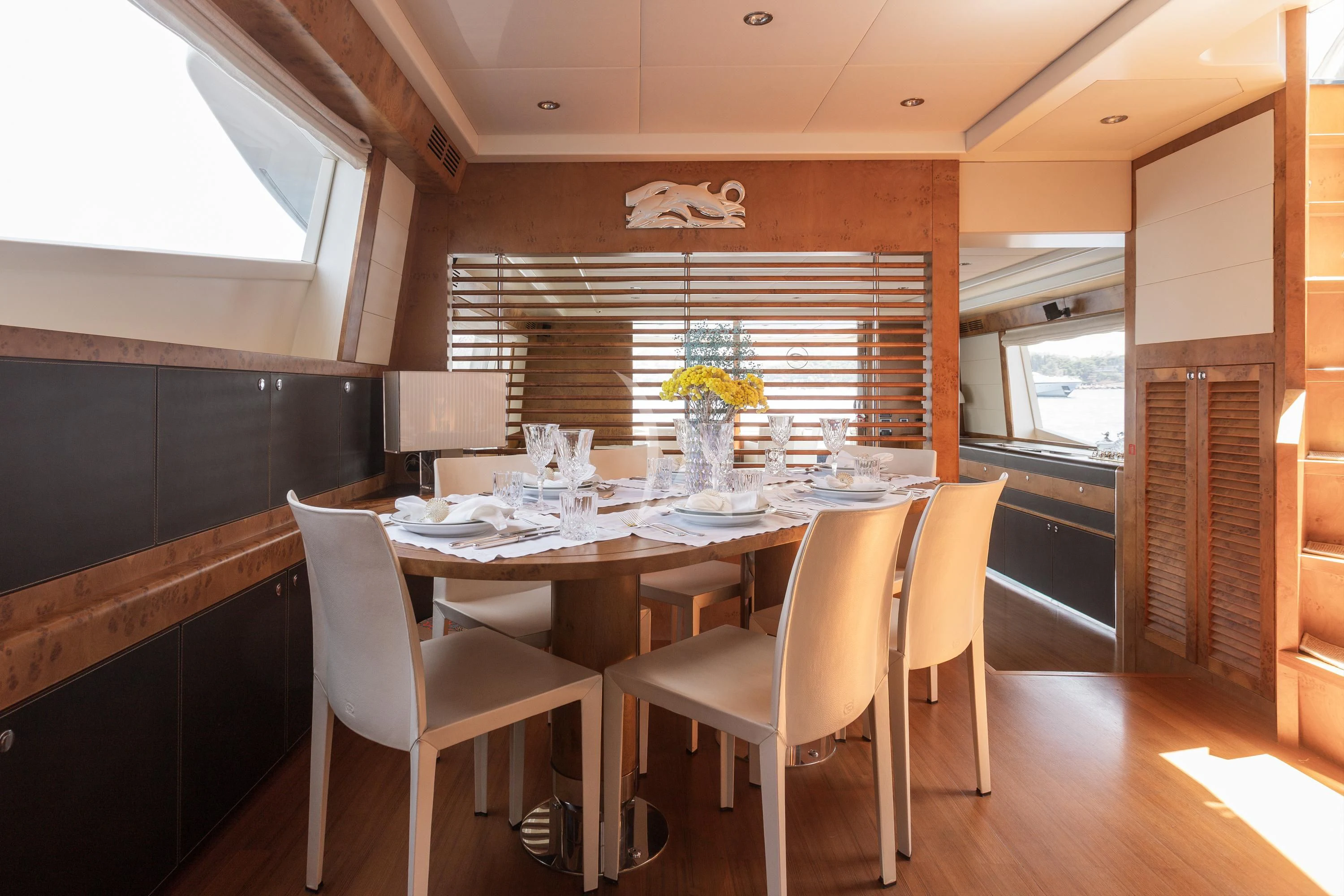 a dining table in a room aboard ANLIA Yacht for Sale