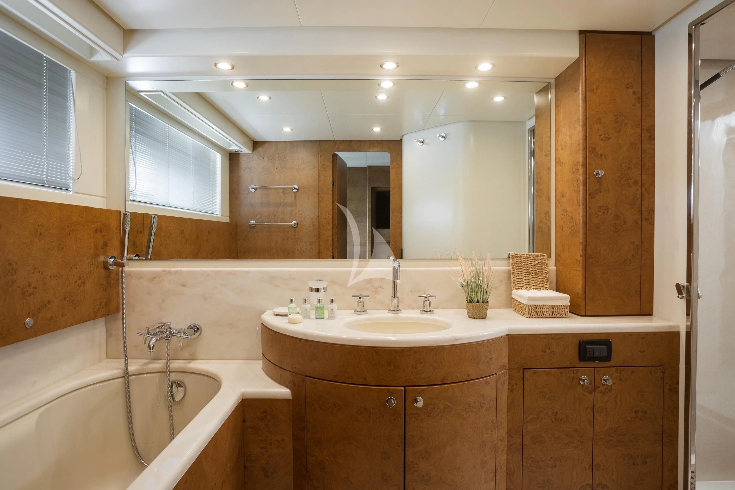 a bathroom with a tub sink and cabinets aboard ANLIA Yacht for Sale