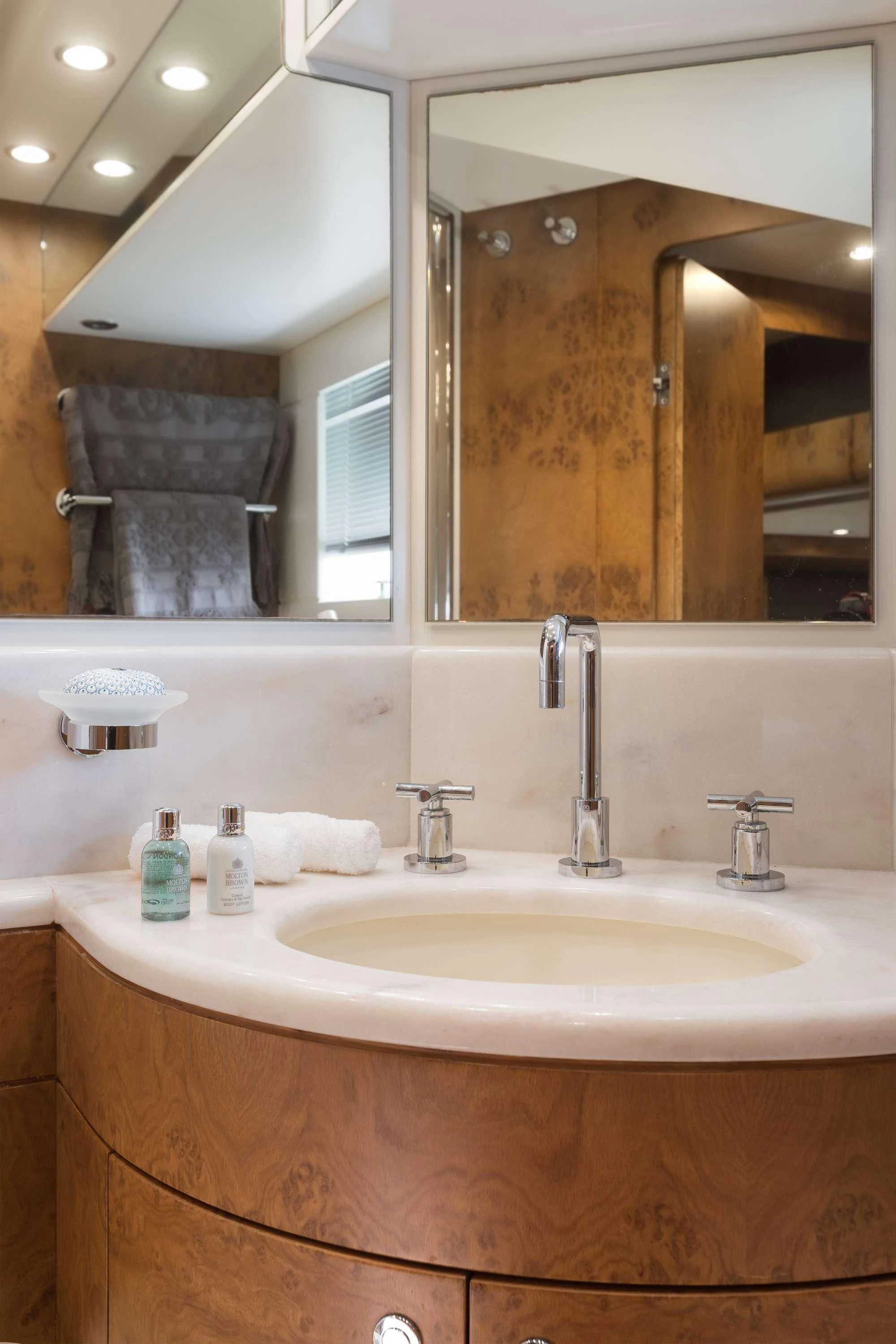 a bathroom with a large mirror aboard ANLIA Yacht for Sale