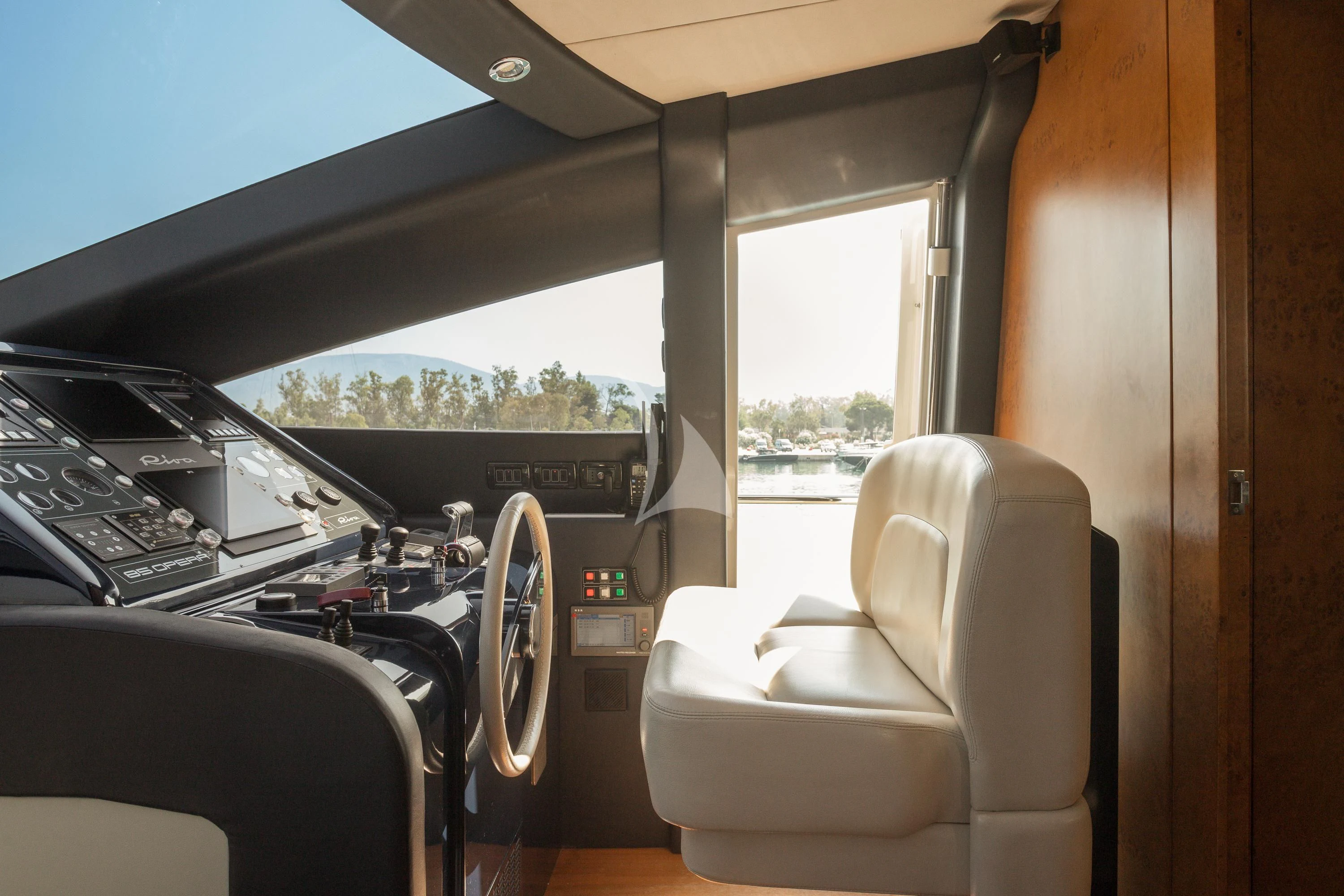 inside of a vehicle with a view of the mountains and trees aboard ANLIA Yacht for Sale