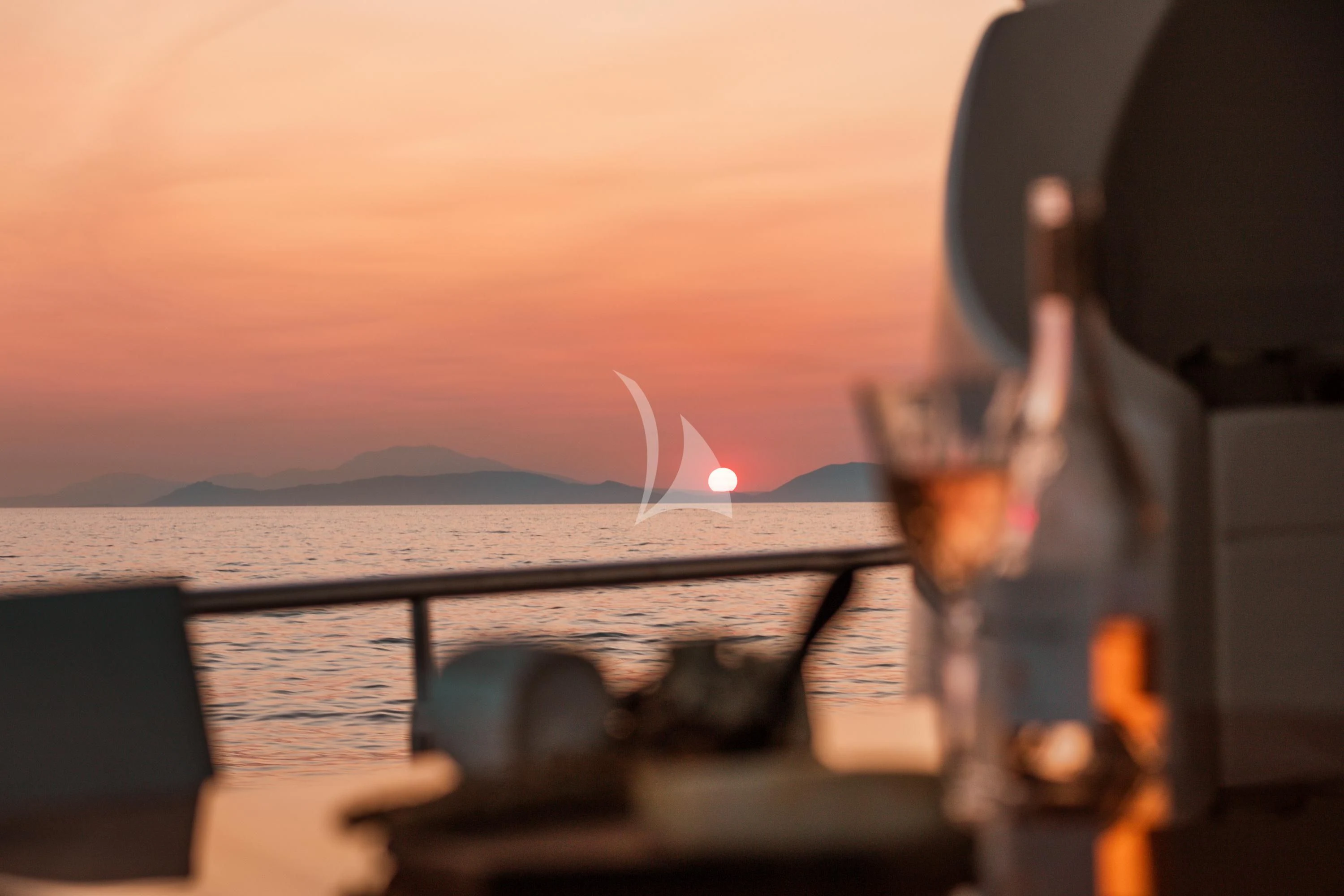 a person holding a glass of wine aboard ANLIA Yacht for Sale
