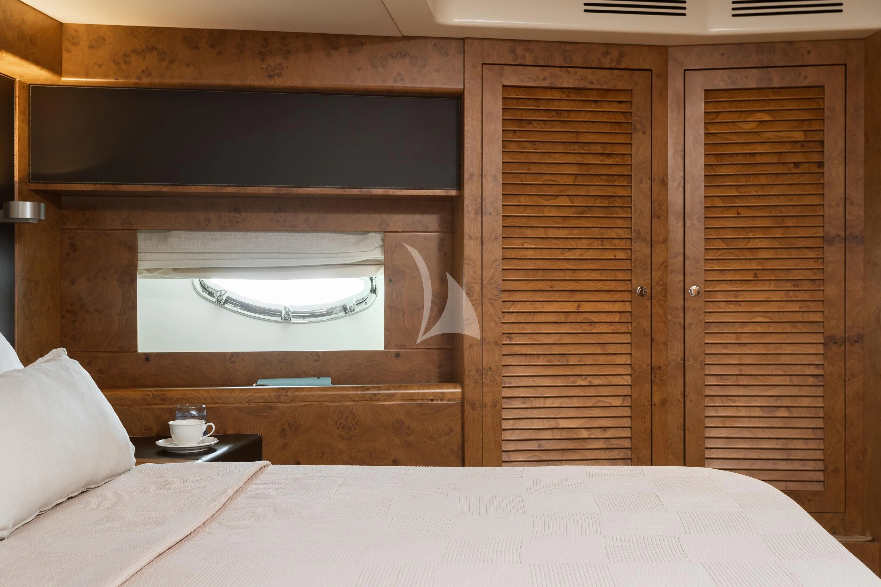 a bed with a window aboard ANLIA Yacht for Sale
