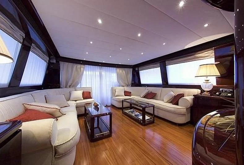 a living room with a couch and a table aboard ANLIA Yacht for Sale