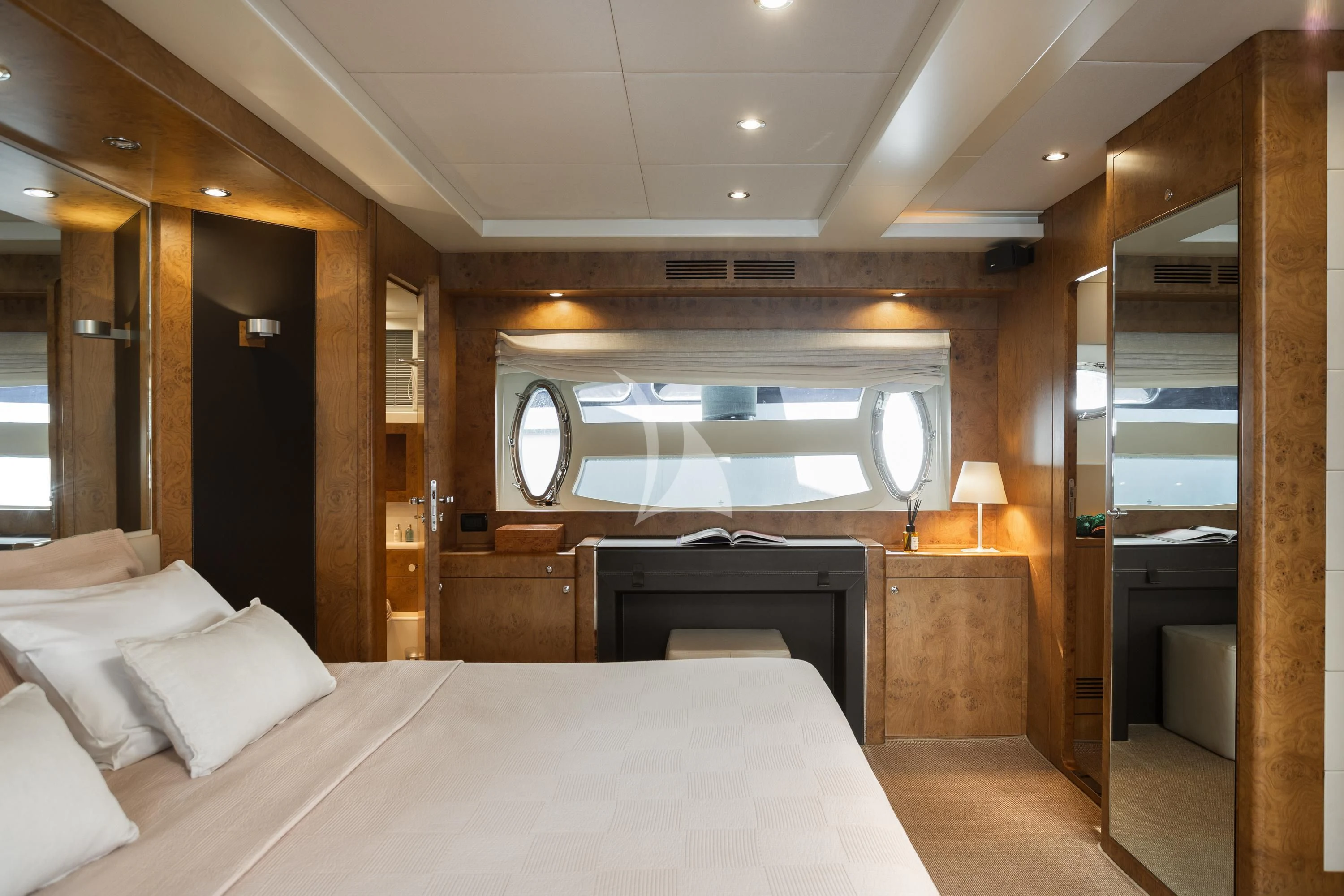 a room with a bed and a large mirror aboard ANLIA Yacht for Sale