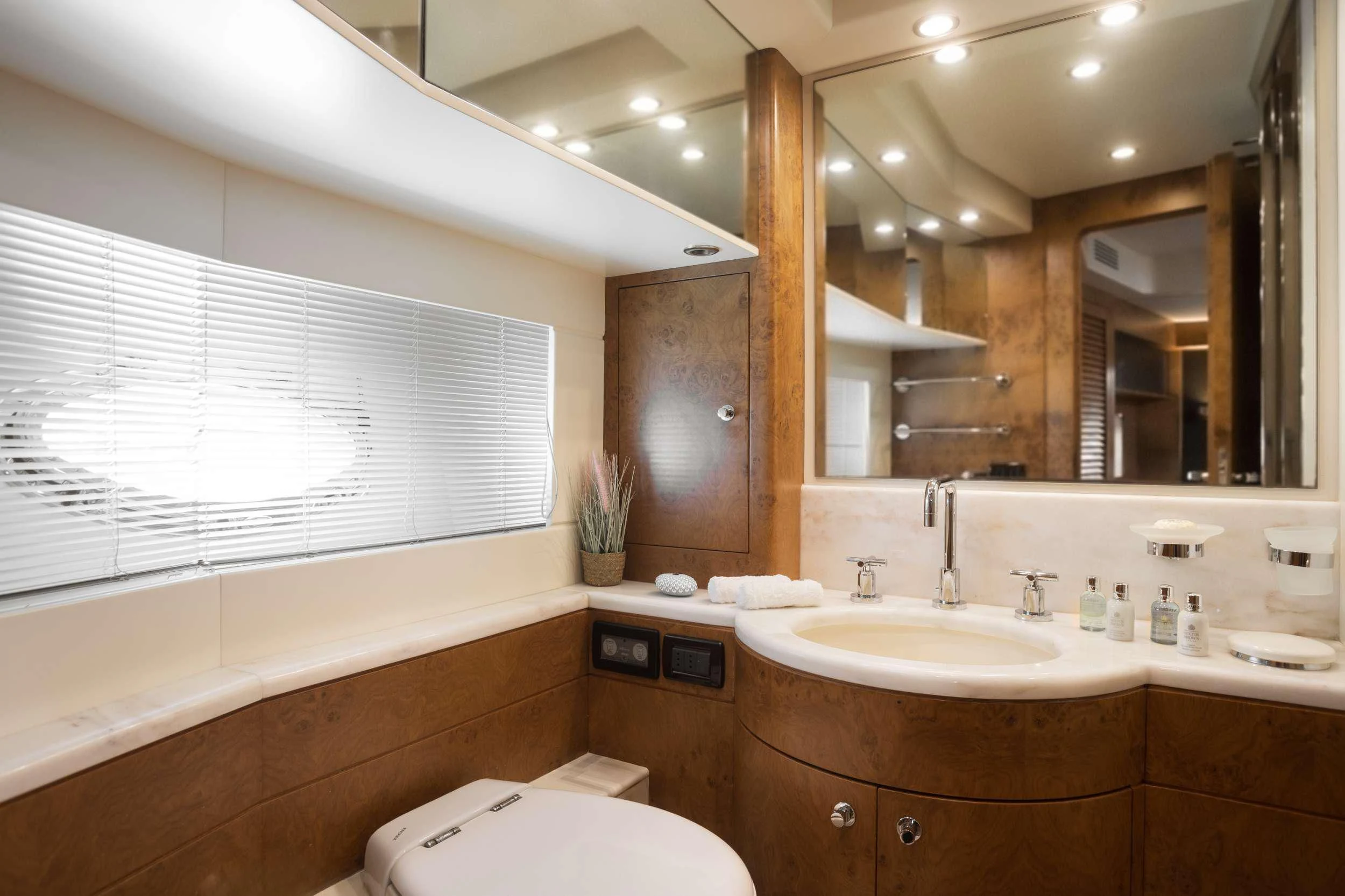 a bathroom with a large mirror aboard ANLIA Yacht for Sale