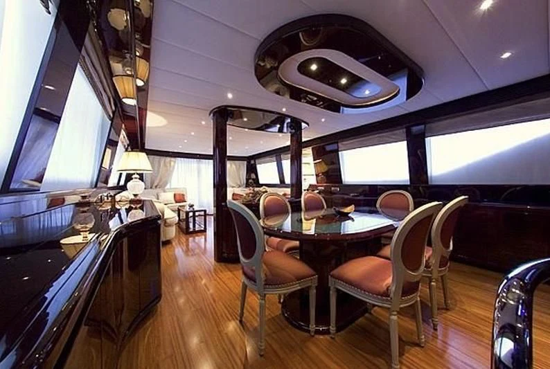 a room with a table and chairs aboard ANLIA Yacht for Sale