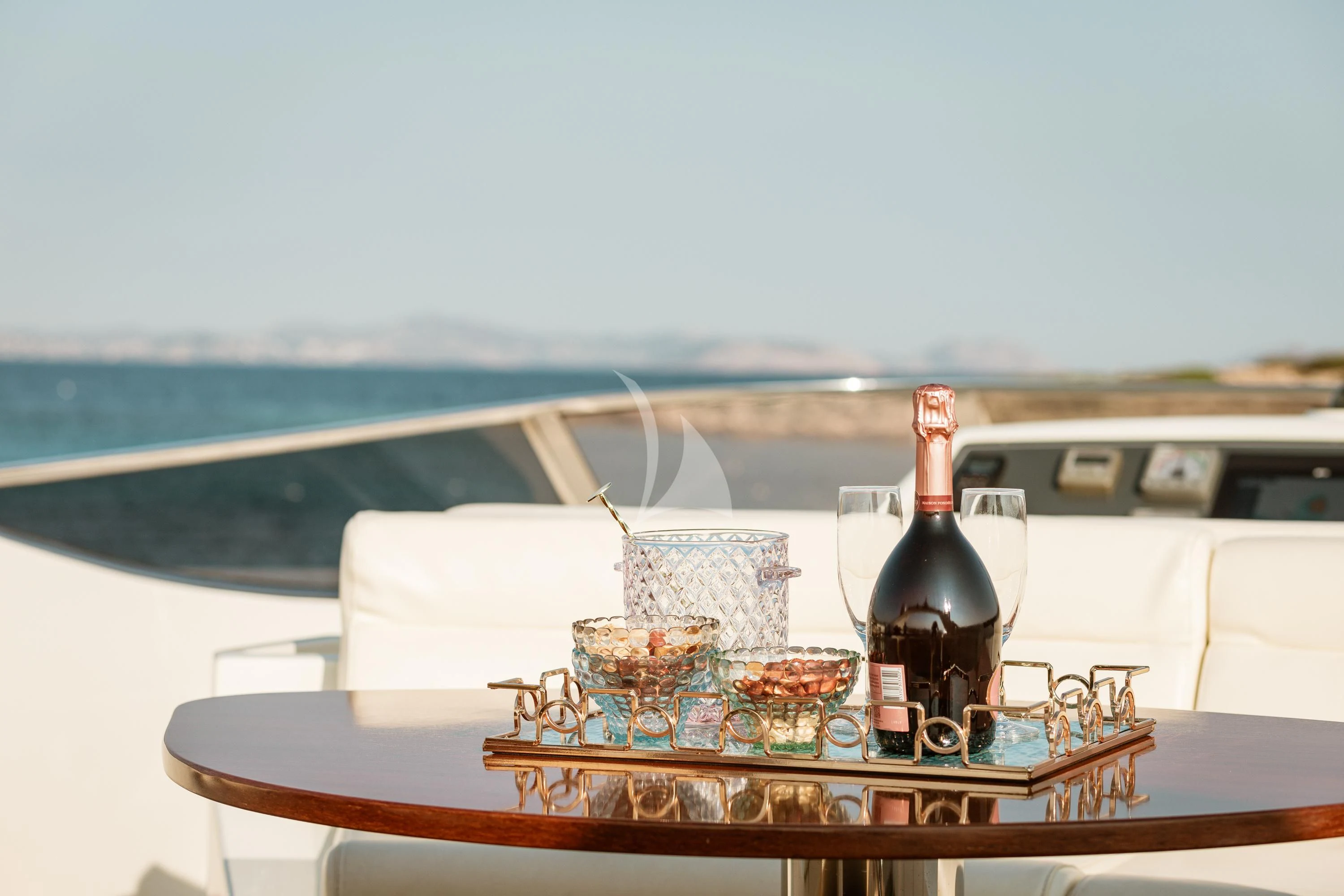 a bottle of wine on a boat aboard ANLIA Yacht for Sale
