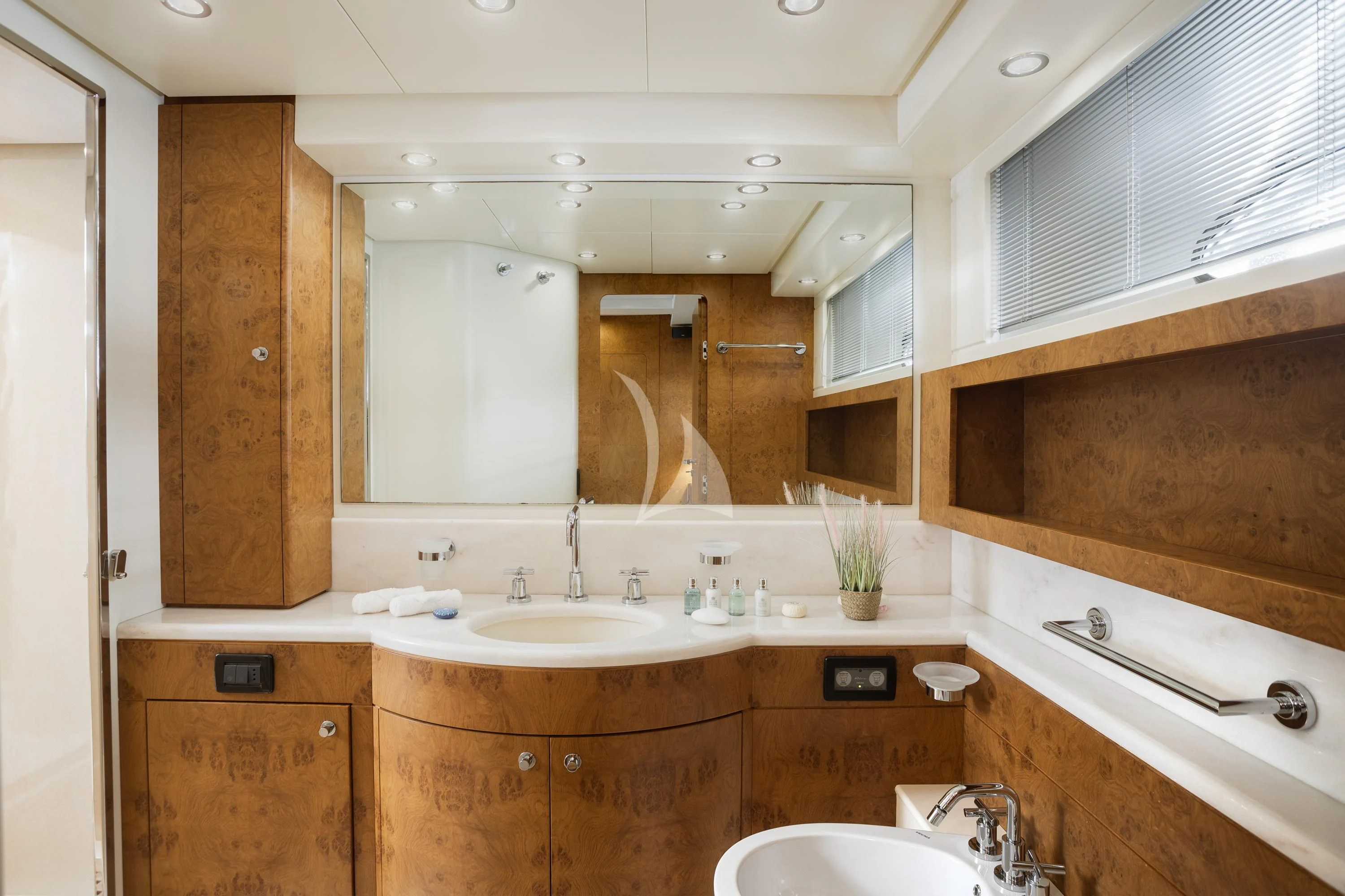 a bathroom with a large mirror aboard ANLIA Yacht for Sale