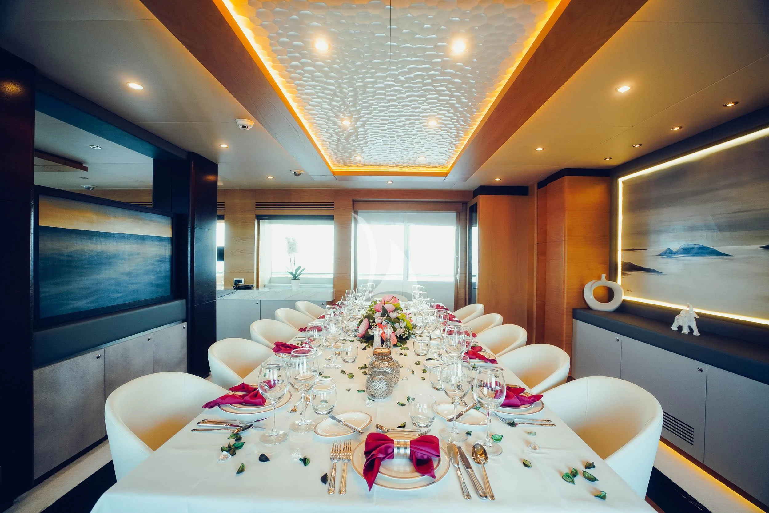 a dining room with a table set aboard TATIANA I Yacht for Sale