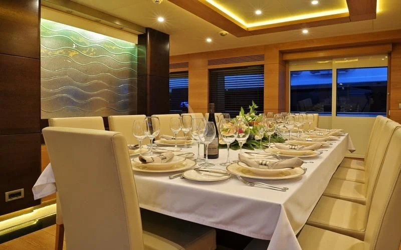 a table set for a dinner aboard TATIANA I Yacht for Sale