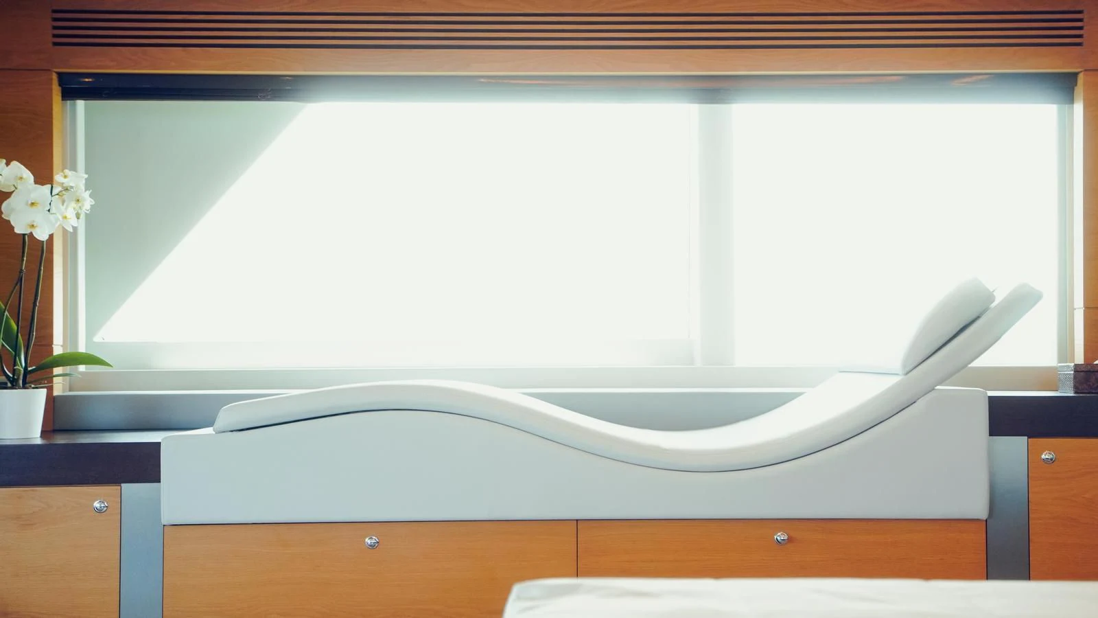 a bathtub with a white wall aboard TATIANA I Yacht for Sale