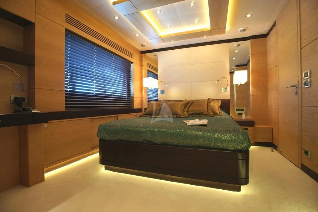 a bed in a room aboard TATIANA I Yacht for Sale
