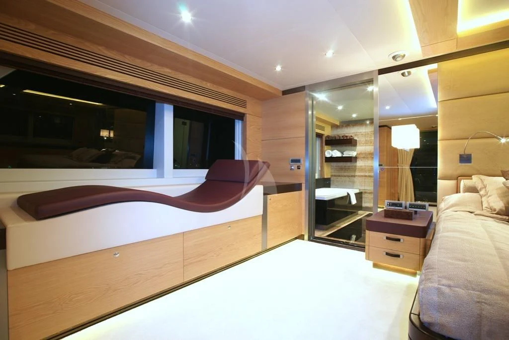 a room with a bed and a mirror aboard TATIANA I Yacht for Sale