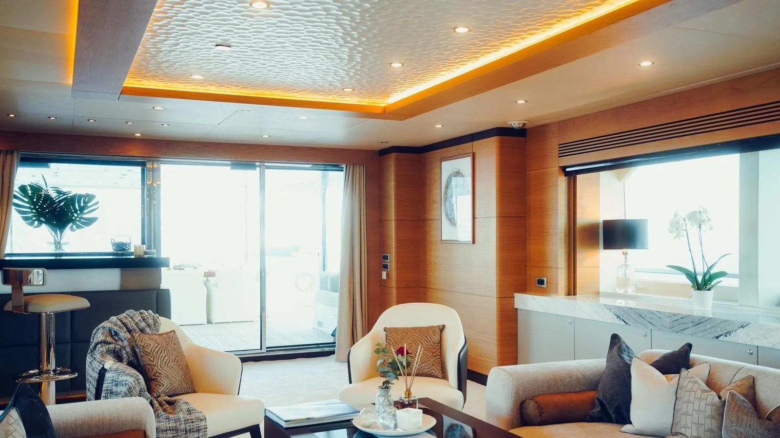 a living room with a large window aboard TATIANA I Yacht for Sale
