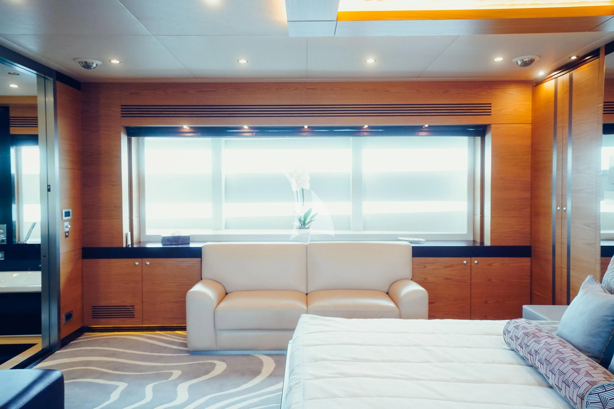 a room with a bed and a window aboard TATIANA I Yacht for Sale