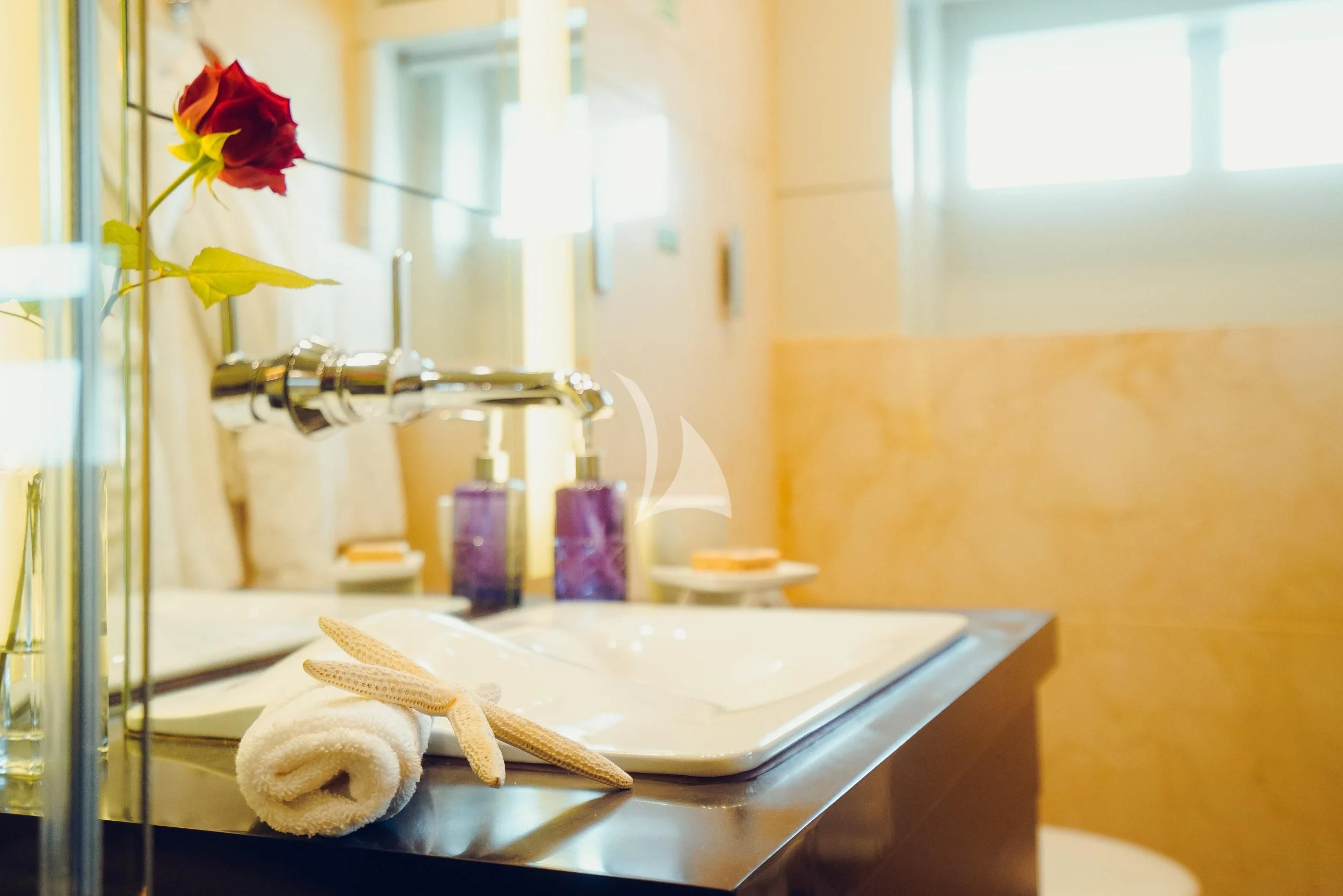 a table with a flower on it aboard TATIANA I Yacht for Sale