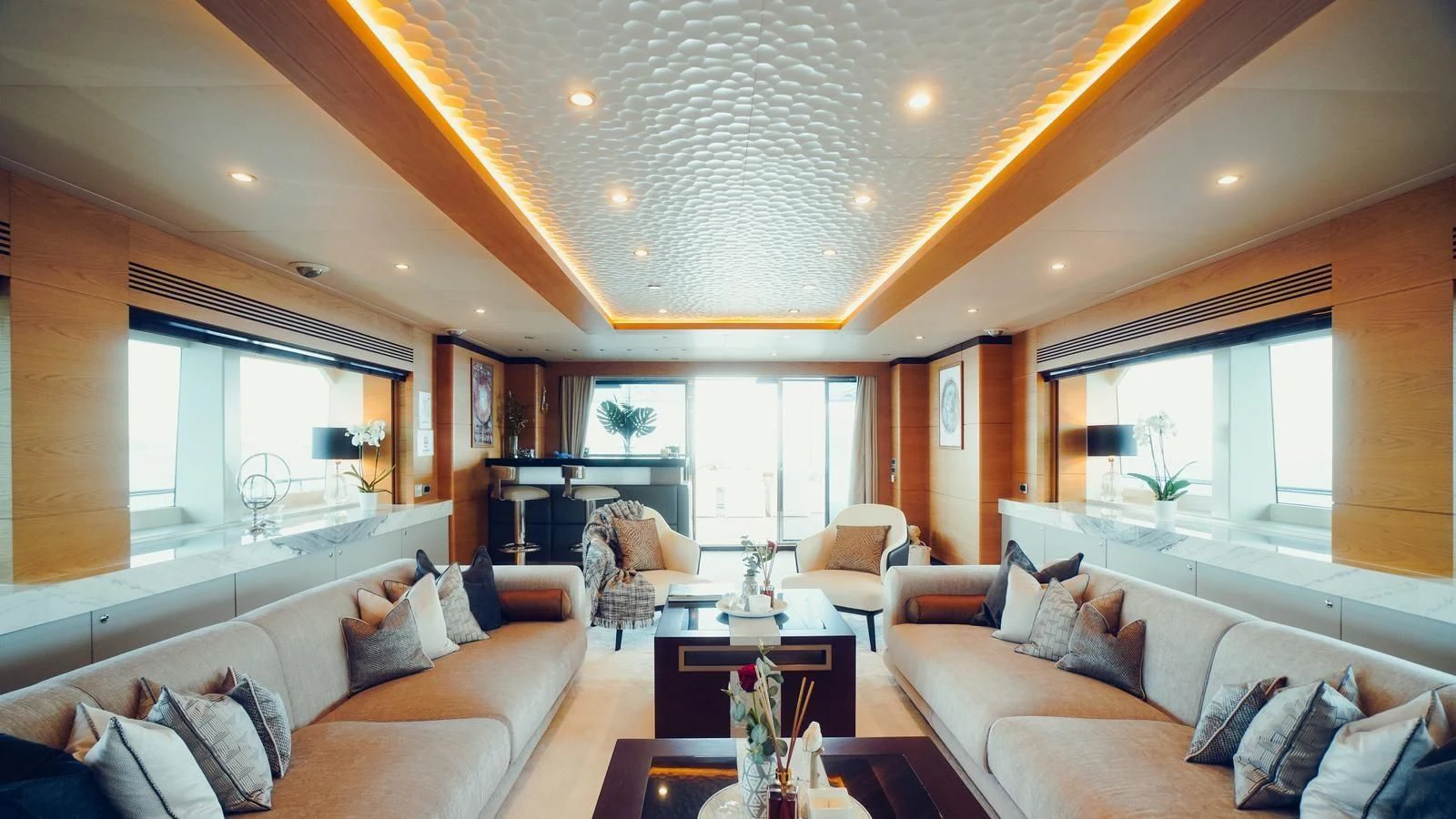 a living room with a couch and a table aboard TATIANA I Yacht for Sale