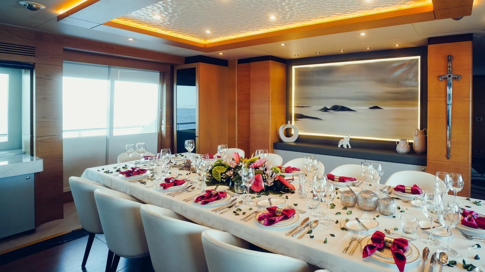 a table with plates and glasses aboard TATIANA I Yacht for Sale