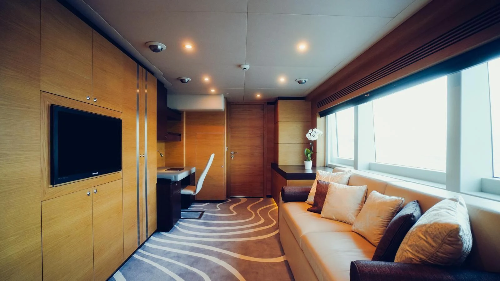 a room with a bed and a tv aboard TATIANA I Yacht for Sale