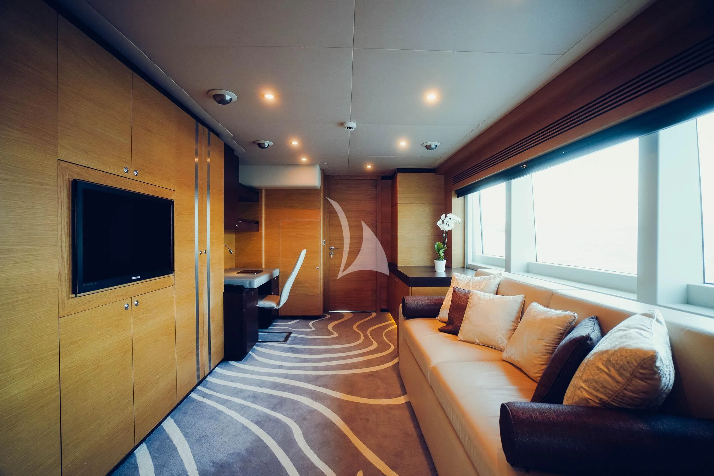 a bedroom with a bed and a tv aboard TATIANA I Yacht for Sale