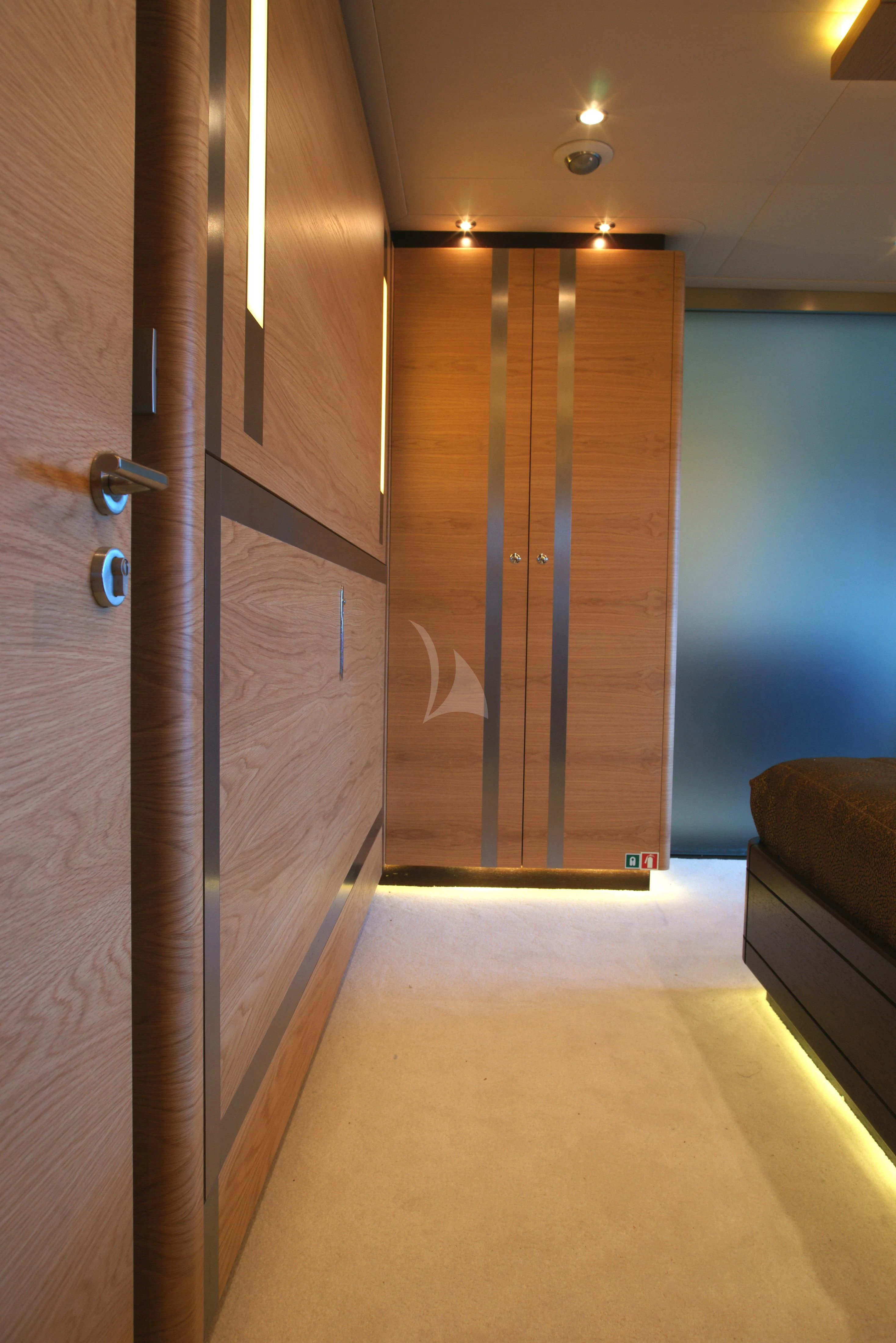 a room with a door and a couch aboard TATIANA I Yacht for Sale