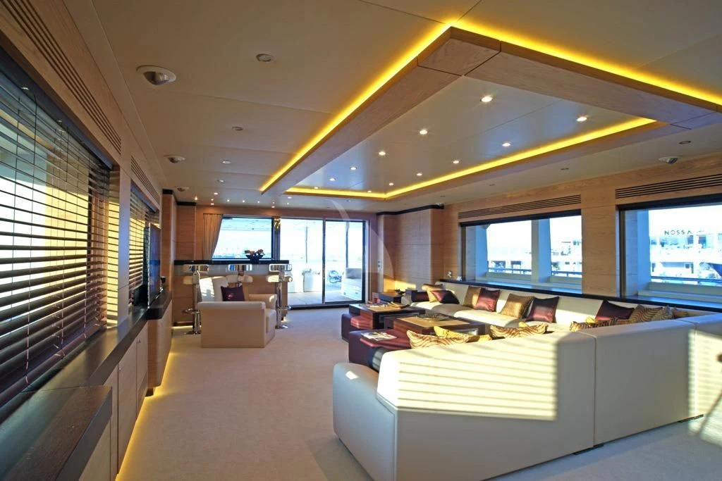 a room with a large window and a couch aboard TATIANA I Yacht for Sale