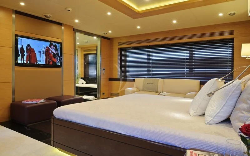 a large bed in a hotel room aboard TATIANA I Yacht for Sale