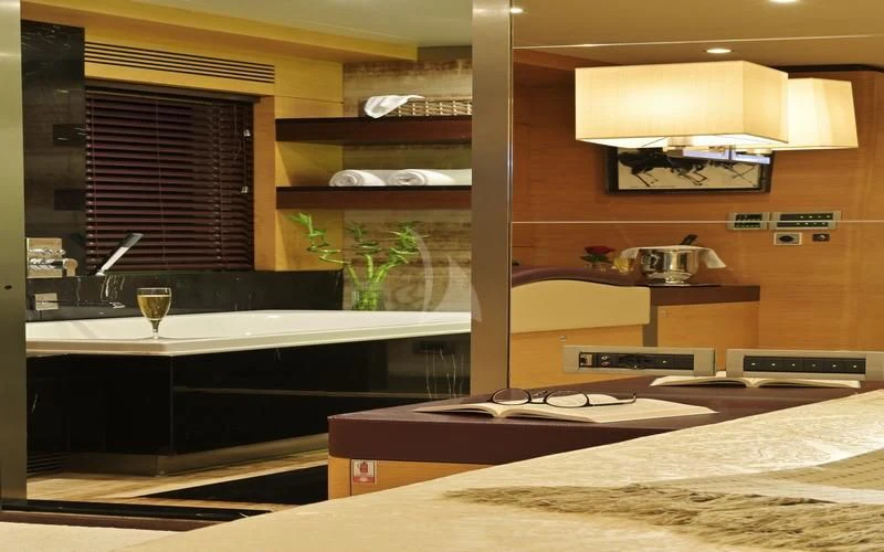 a room with a table and a window aboard TATIANA I Yacht for Sale