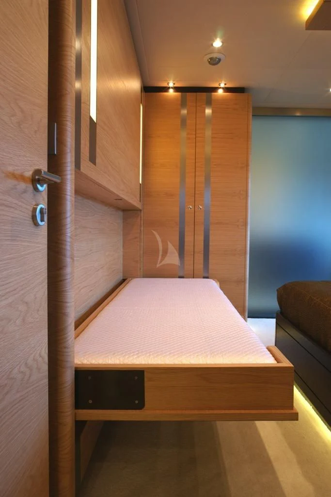 a bed in a room aboard TATIANA I Yacht for Sale