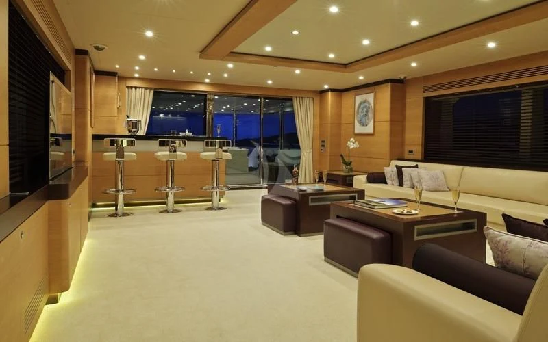 a large living room with a large window aboard TATIANA I Yacht for Sale