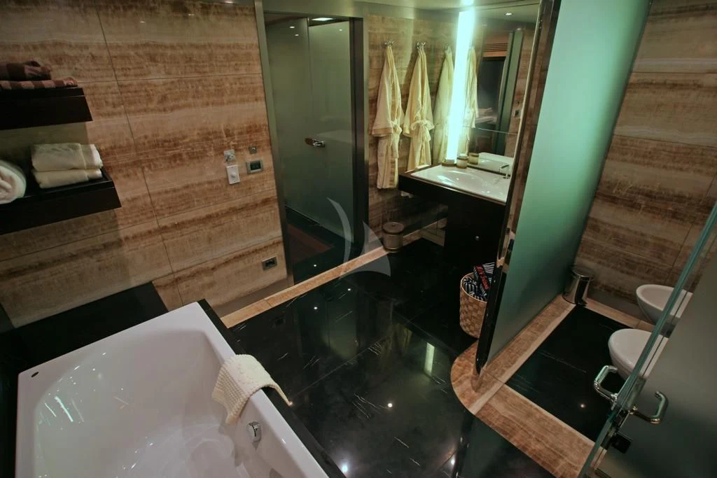 a bathroom with a large mirror aboard TATIANA I Yacht for Sale