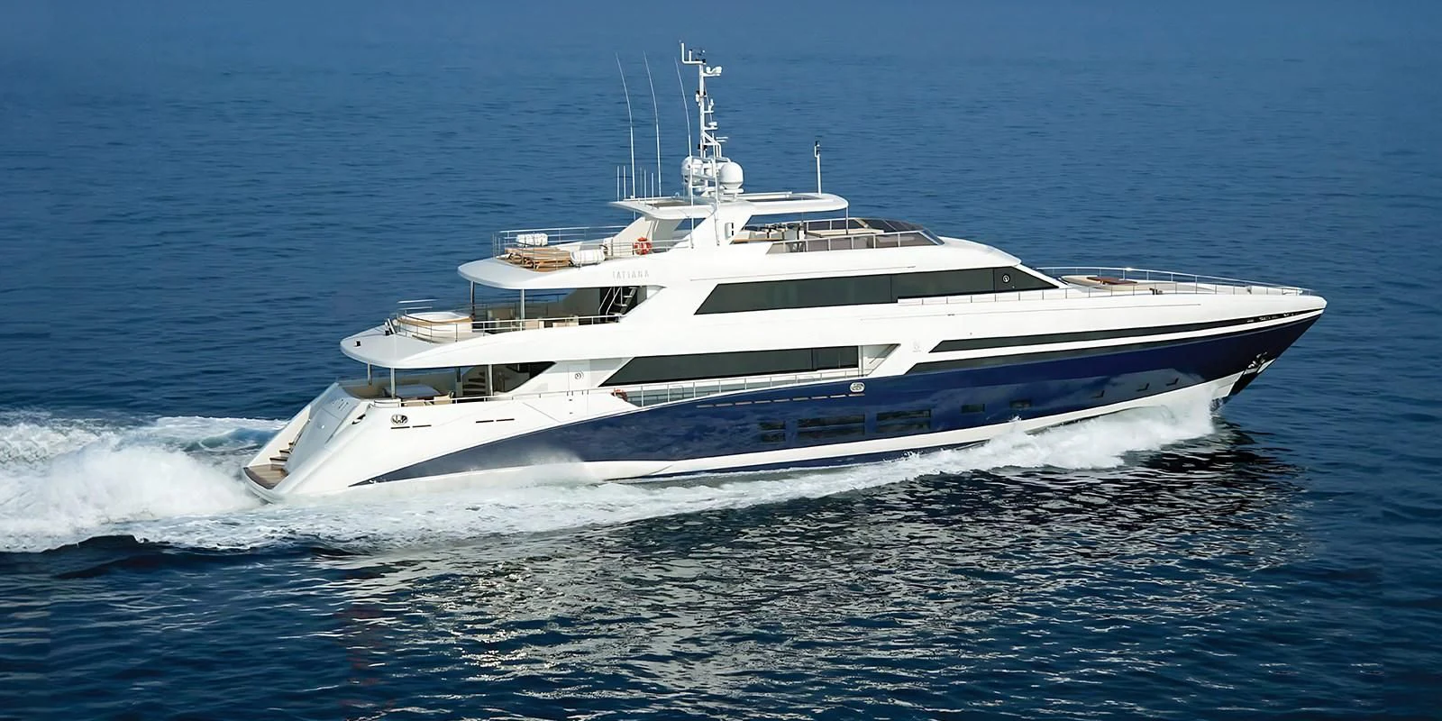 a white yacht on the water aboard TATIANA I Yacht for Sale