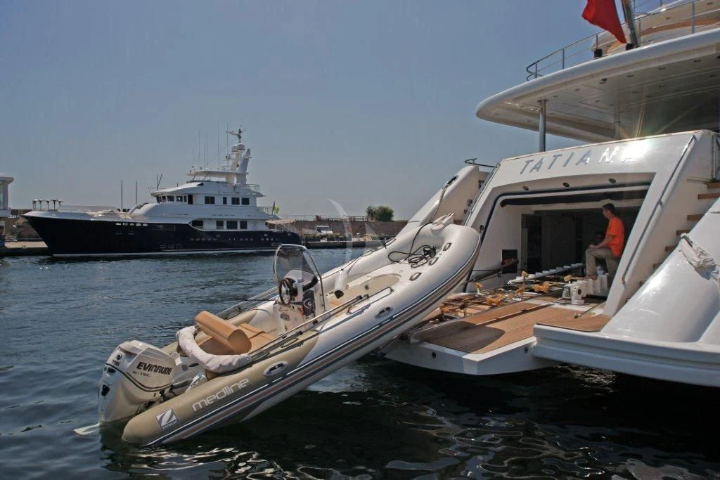 a boat with a person standing on the deck aboard TATIANA I Yacht for Sale