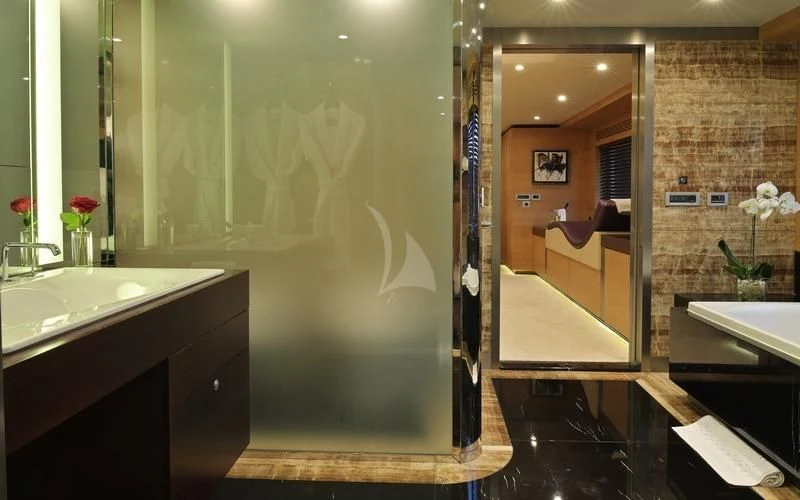 a bathroom with a large mirror aboard TATIANA I Yacht for Sale