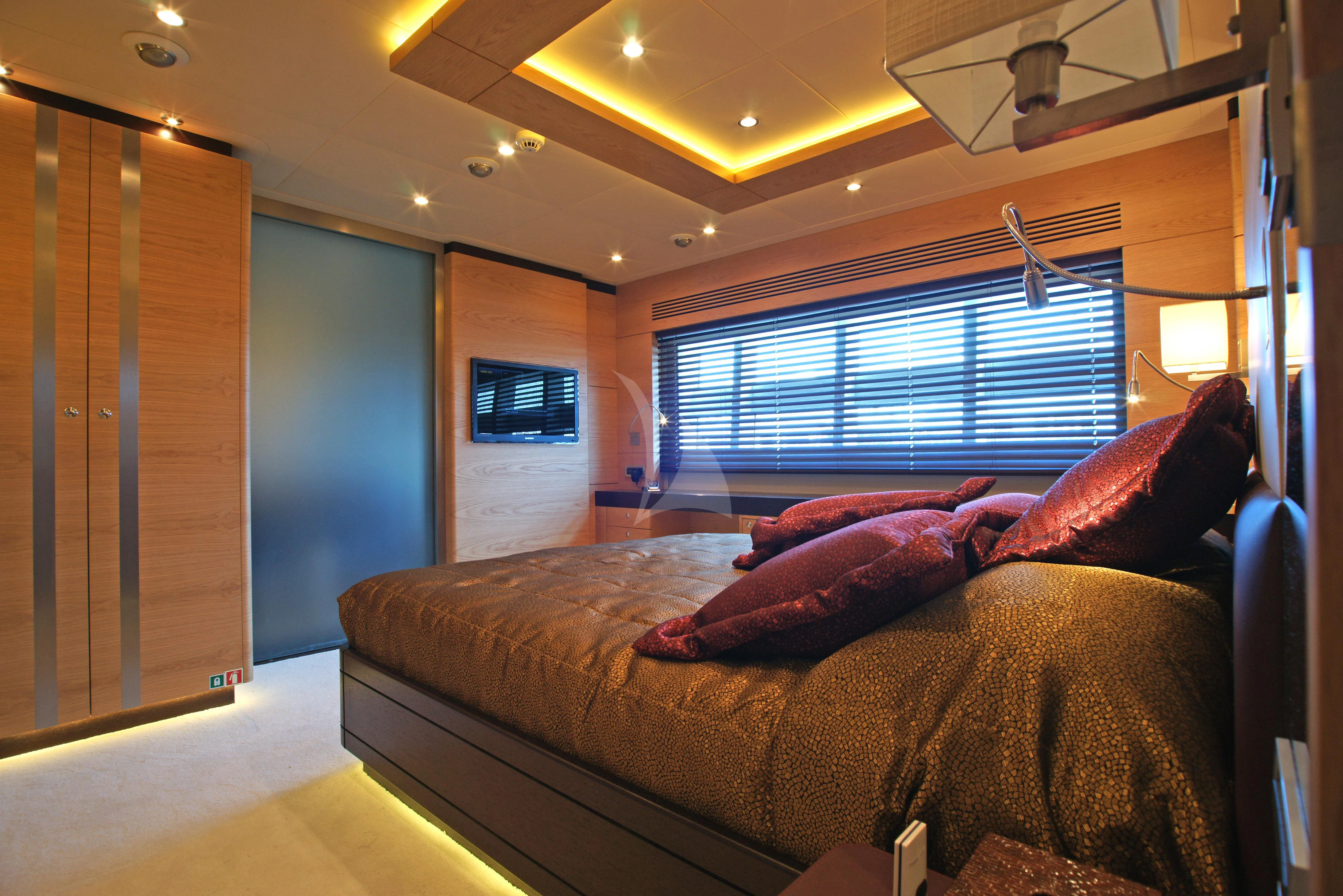 a bed in a room aboard TATIANA I Yacht for Sale
