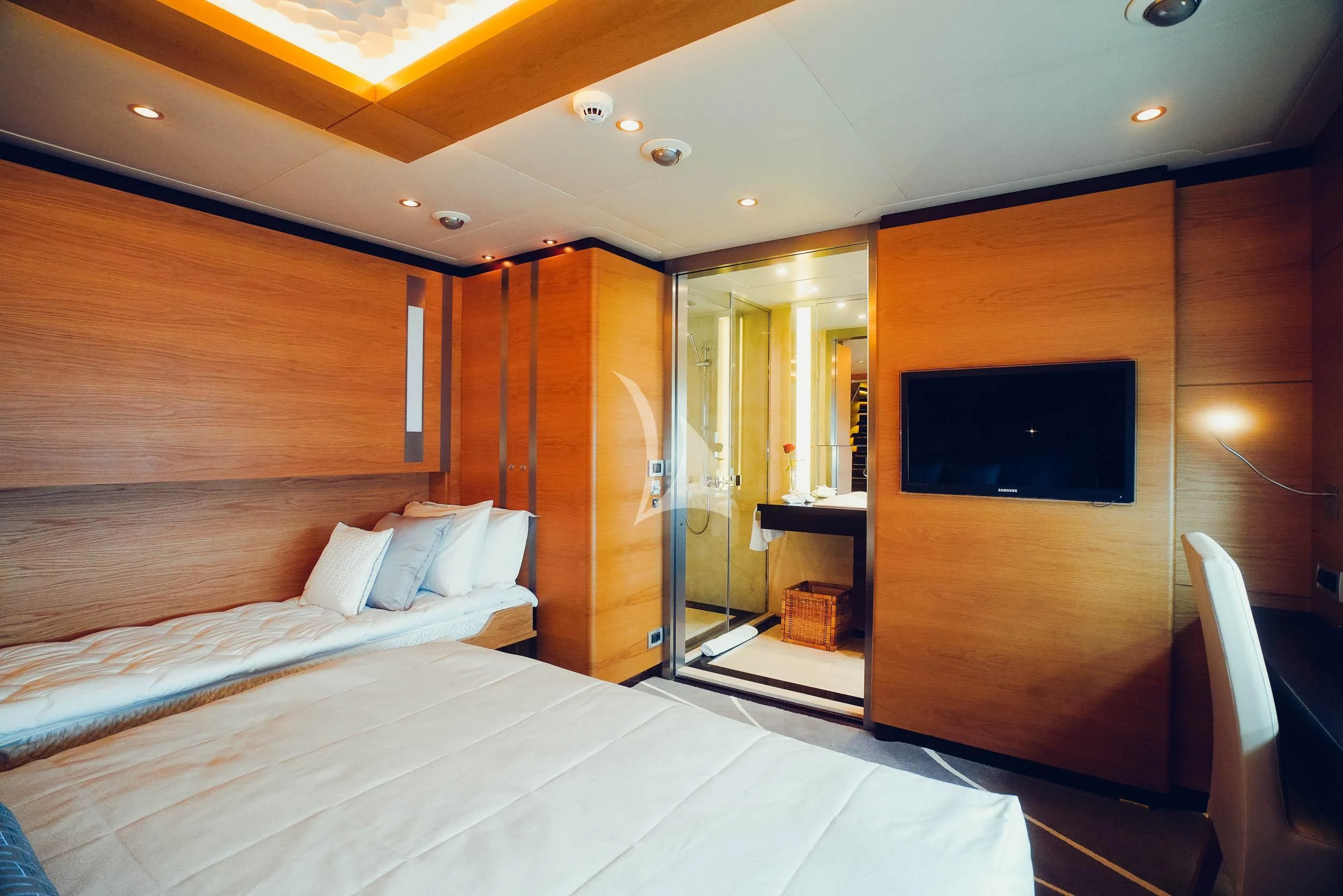a room with a bed and a television aboard TATIANA I Yacht for Sale