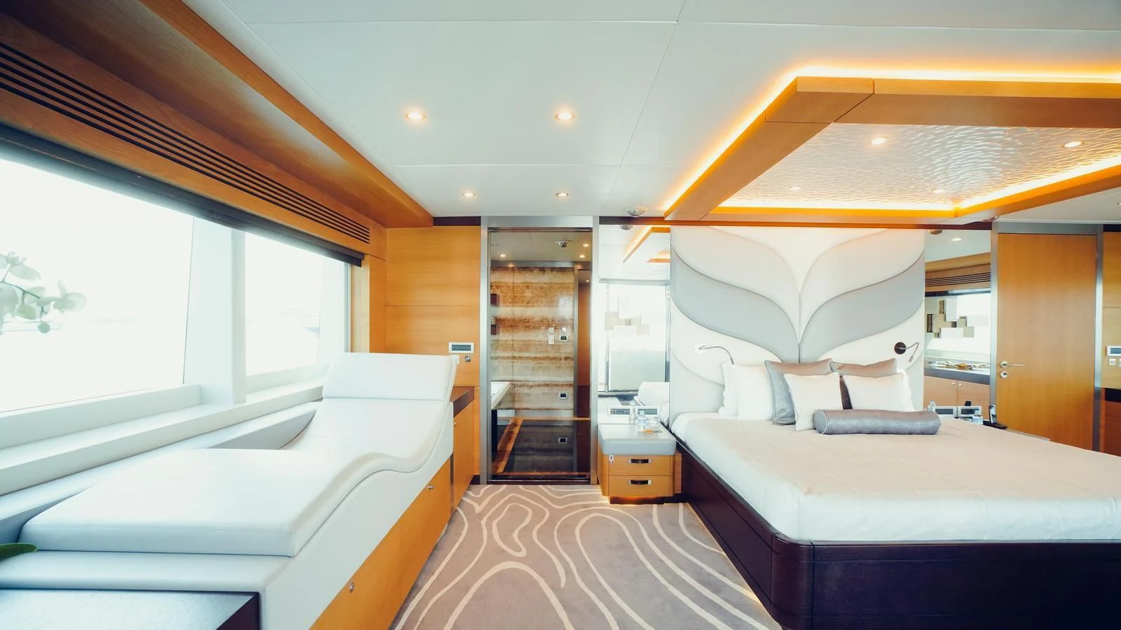 a room with a bed and a mirror aboard TATIANA I Yacht for Sale