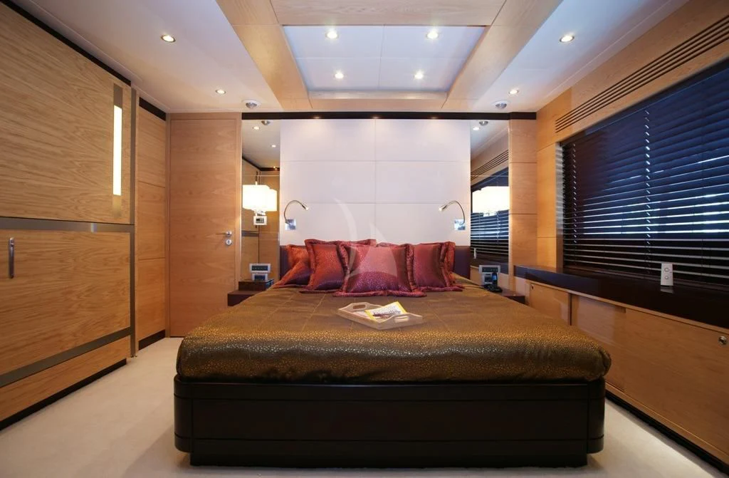 a large bed in a room aboard TATIANA I Yacht for Sale